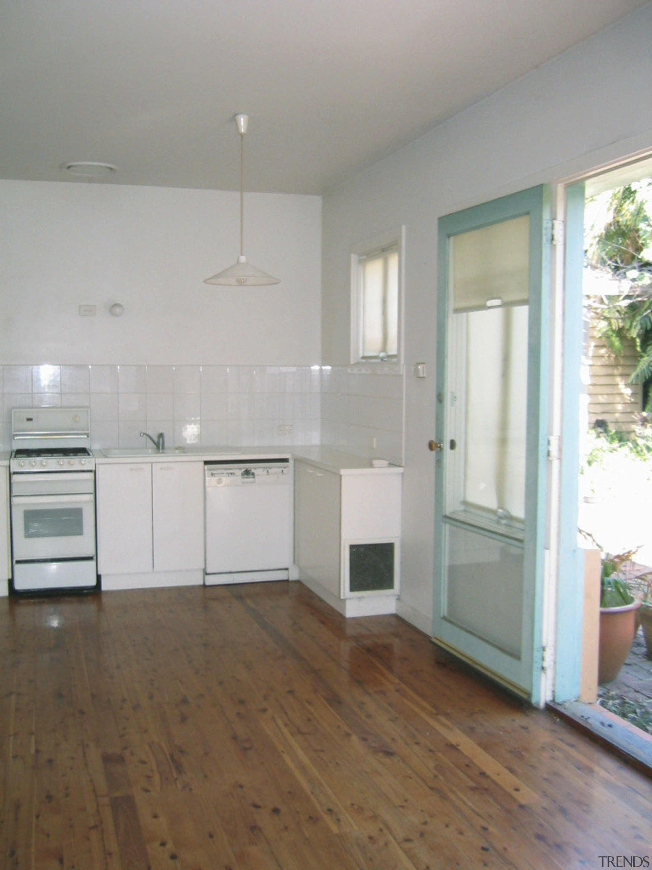 View of kitchen prior to renovations. - View cabinetry, daylighting, floor, flooring, hardwood, home, house, interior design, kitchen, laminate flooring, property, real estate, room, wall, window, wood, wood flooring, gray