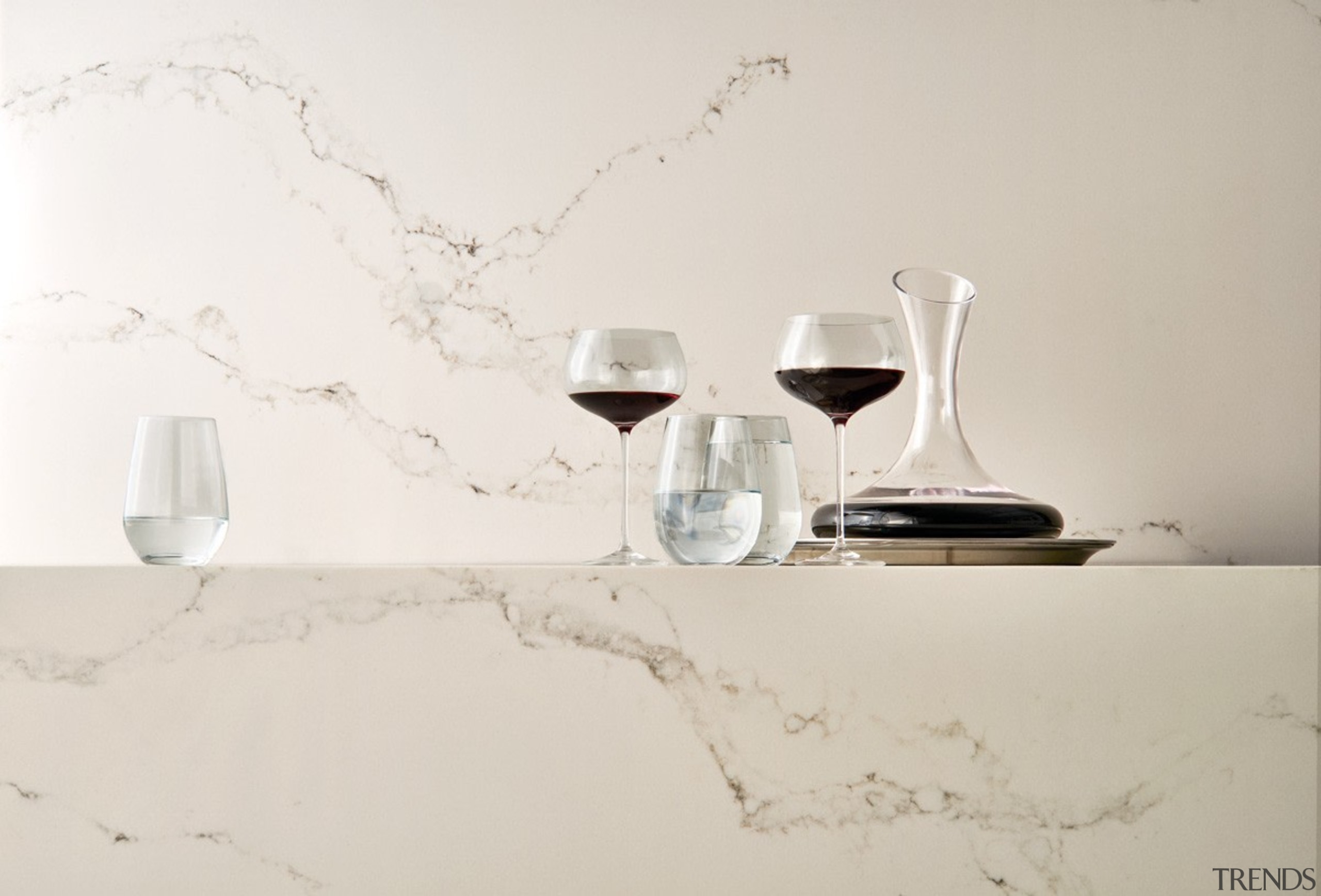 Caesarstone's interpretation of Statuario marble; Statuario Nuvo brings furniture, interior design, lighting accessory, product design, still life photography, table, tap, white