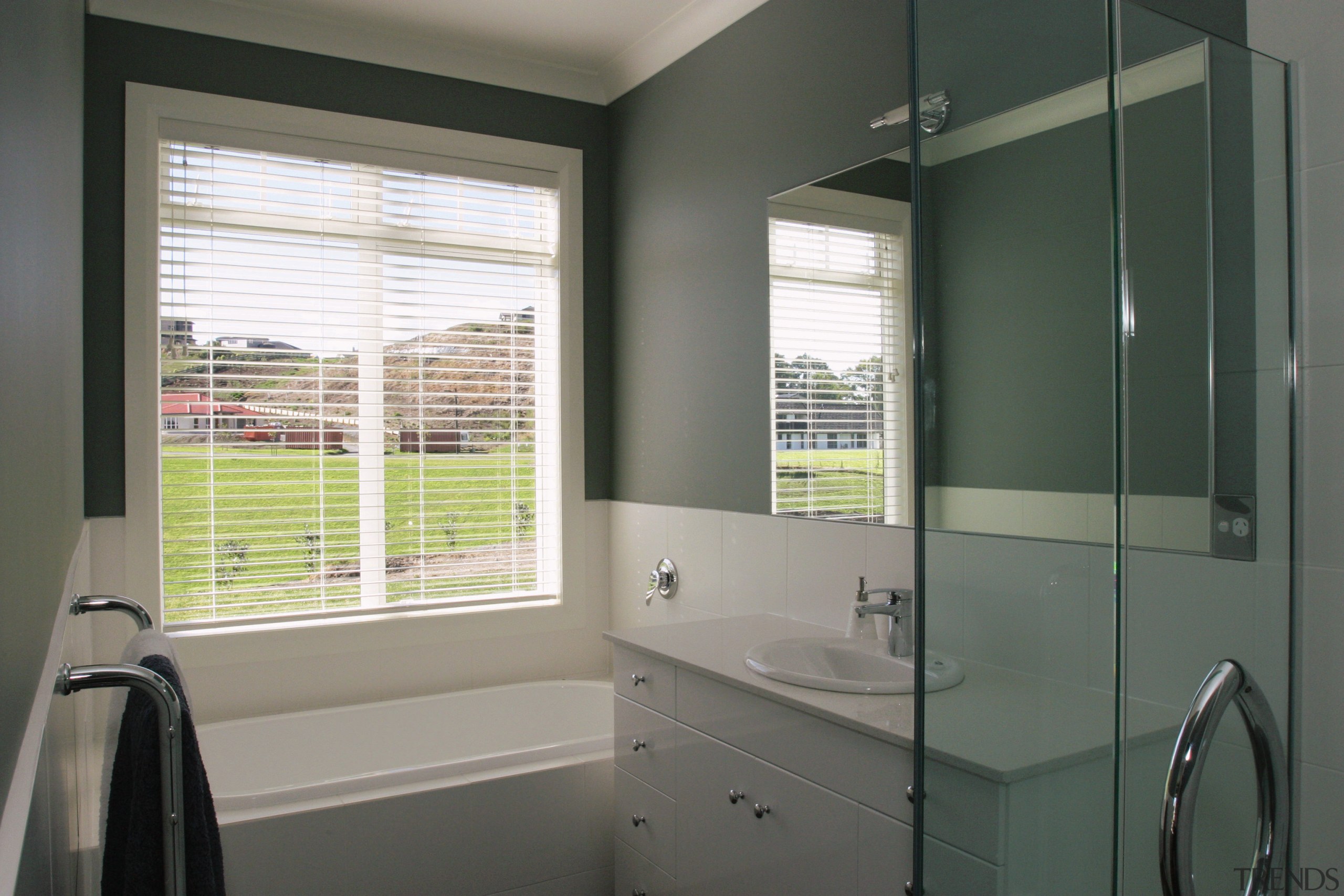 A view of the bathroom, dark grey walls, bathroom, bathroom accessory, bathroom cabinet, home, interior design, real estate, room, window, window covering, window treatment, gray, black