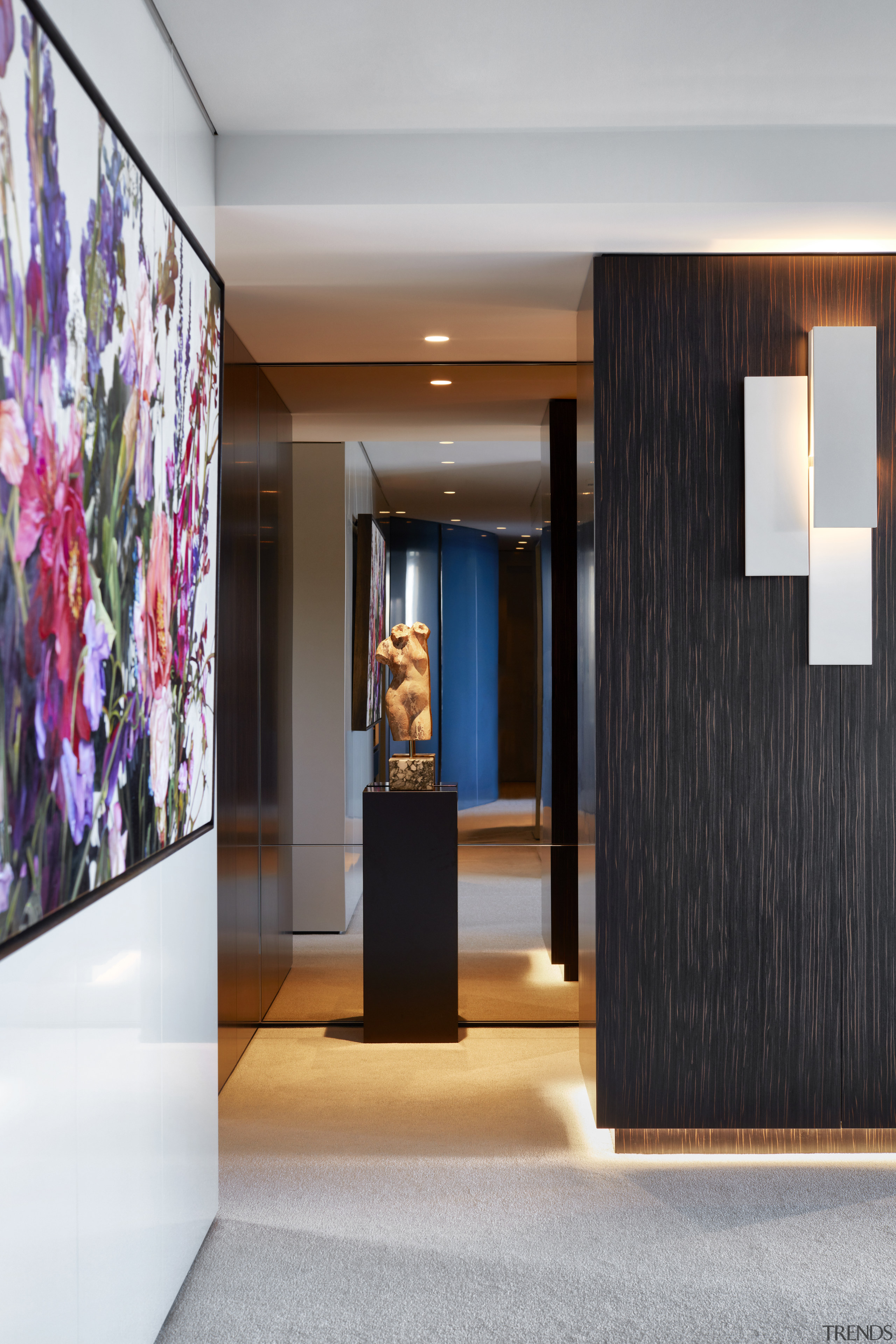 ​​​​​​​On this apartment makeover, immovable pillars are clad architecture, design, door, floor, flooring, furniture, hall, house, interior design, lighting, gray, black, Archer Design