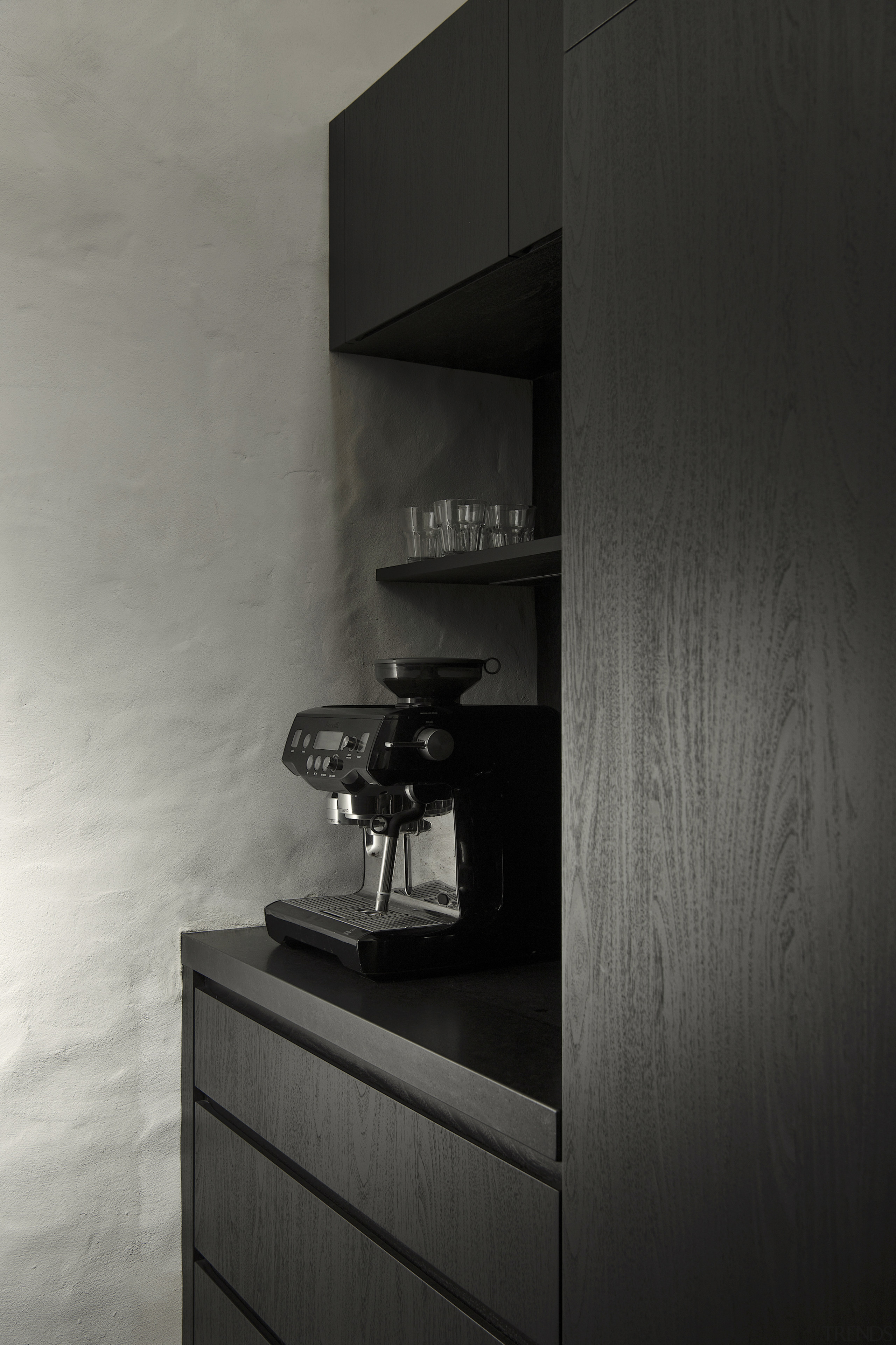 Handleless cabinetry adds to the minimalist vibe. 