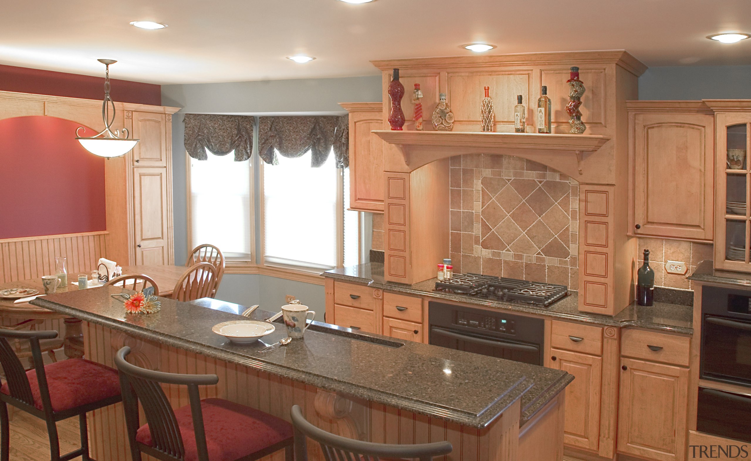 A view of this kitchen designed by Designer cabinetry, countertop, cuisine classique, flooring, home, interior design, kitchen, room, orange, brown