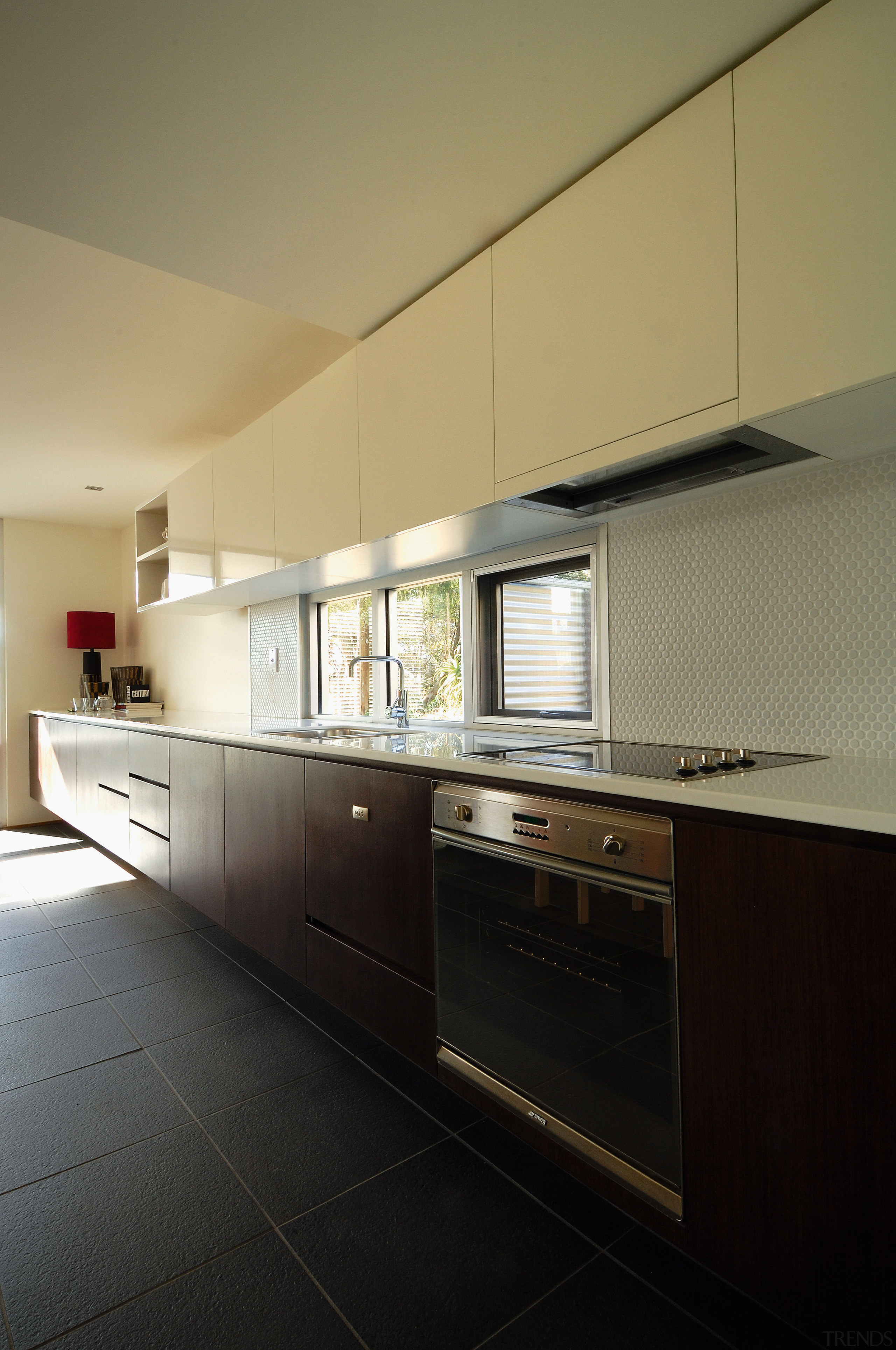 Long timber veneer kitchen cabinetry along one wall, architecture, cabinetry, countertop, daylighting, home, house, interior design, kitchen, real estate, room, black, brown