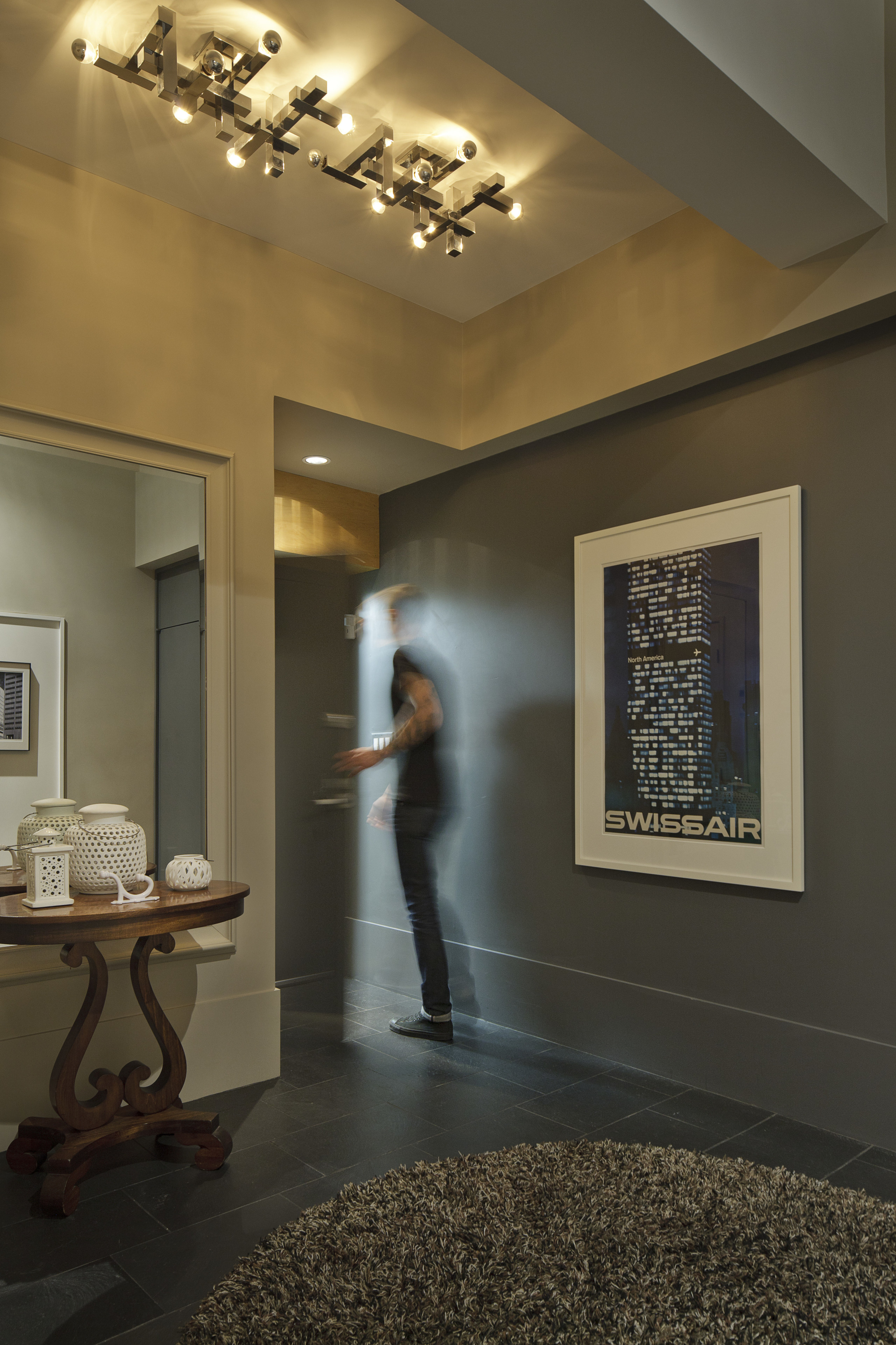 This home was designed by David Hacin of ceiling, exhibition, floor, flooring, interior design, lobby, room, black, brown