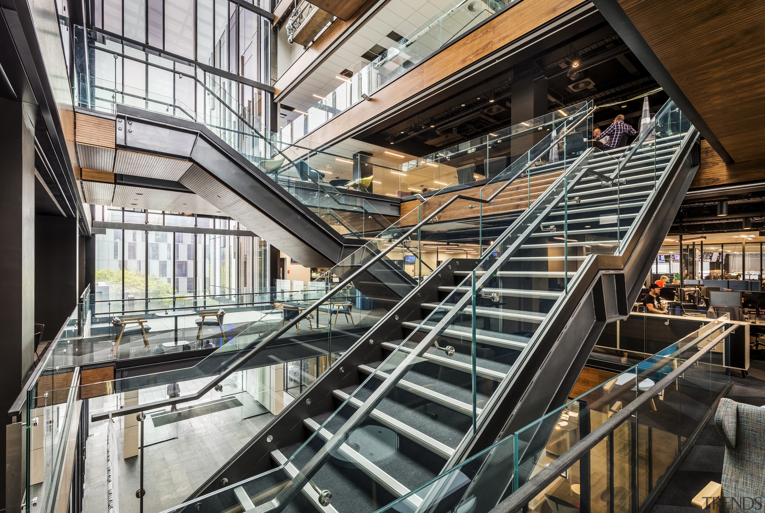 The central atrium of 2 Graham St by architecture, building, handrail, mixed use, stairs, black, white