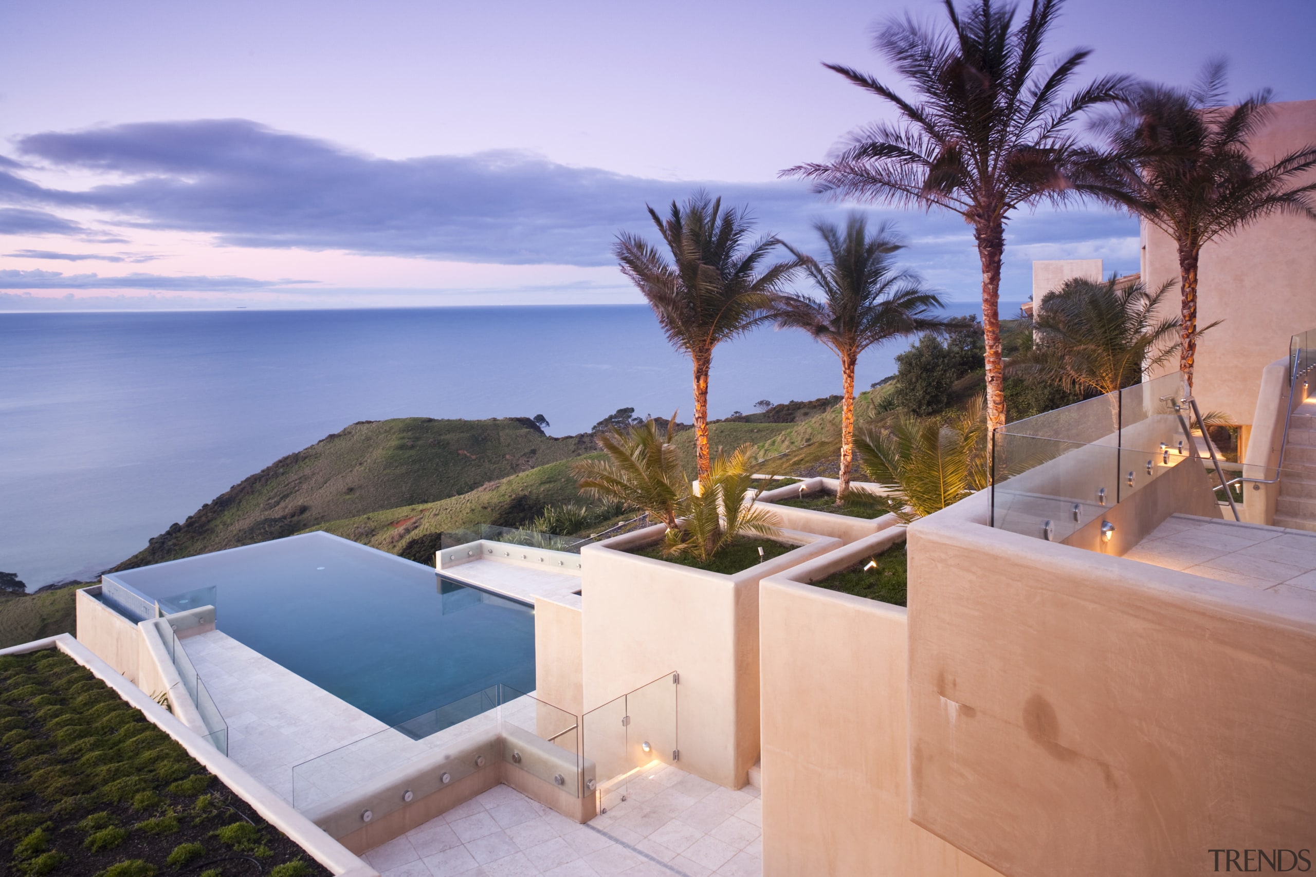 Exterior view of Mediterranean styled house which is estate, home, house, leisure, palm tree, property, real estate, resort, sky, swimming pool, vacation, villa