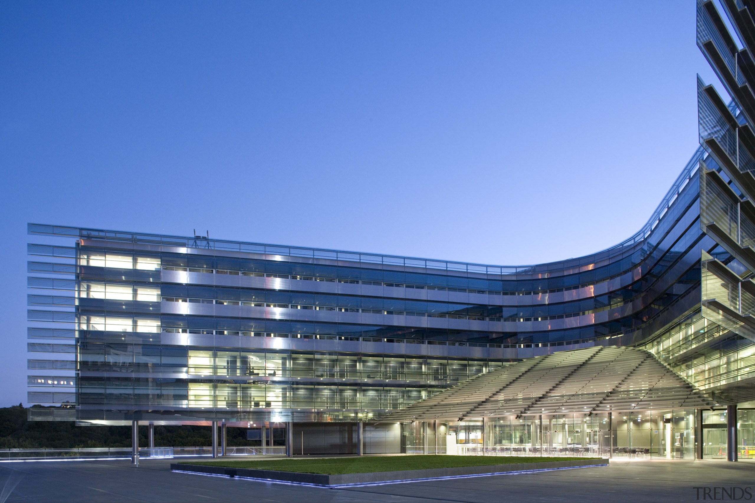 View of the exterior of the Owen G architecture, building, commercial building, condominium, corporate headquarters, daytime, facade, headquarters, landmark, metropolis, metropolitan area, mixed use, sky, structure, teal, blue