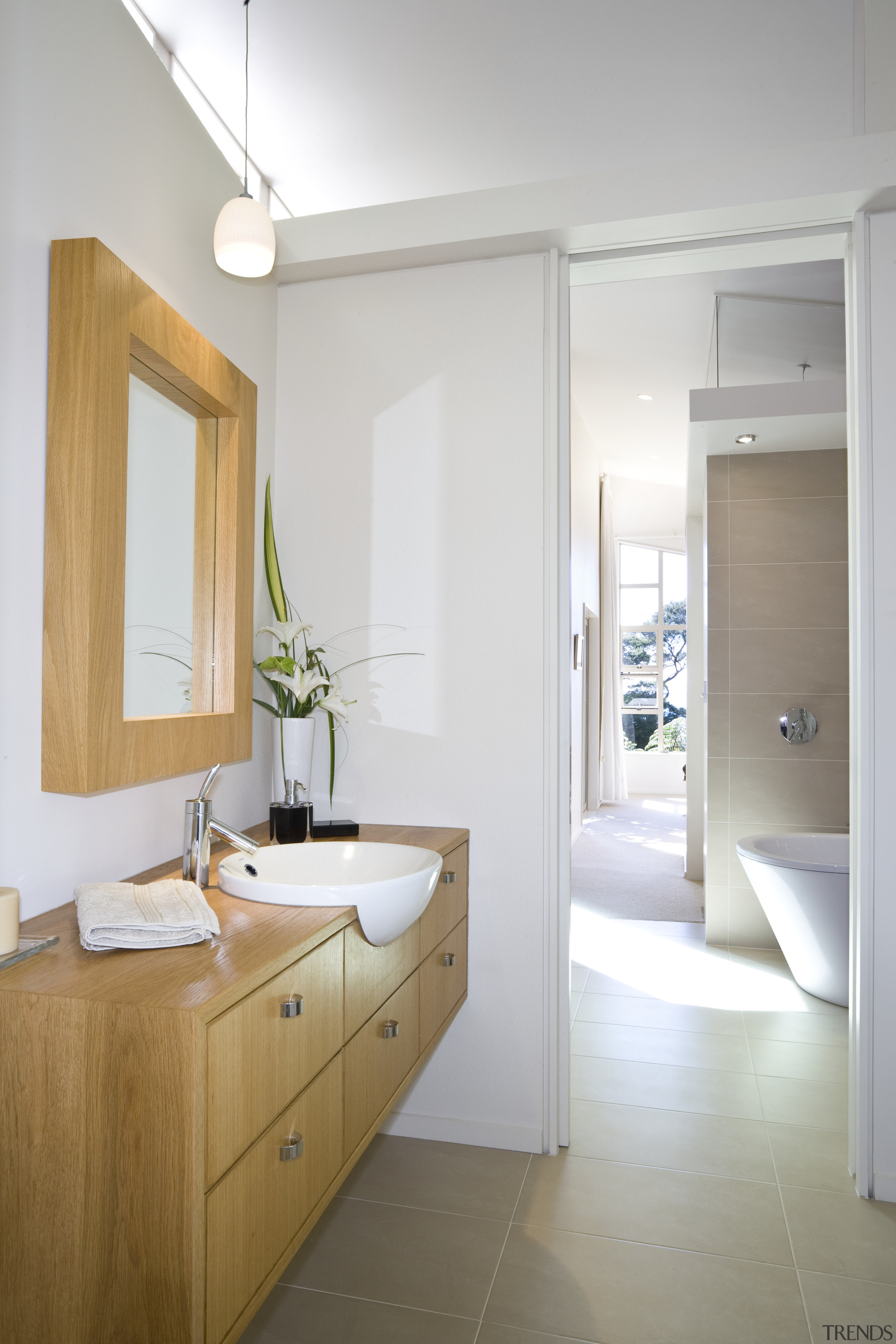 The Bathrooms features Cantilevered oak cabinets help to bathroom, bathroom accessory, bathroom cabinet, floor, home, interior design, room, sink, white