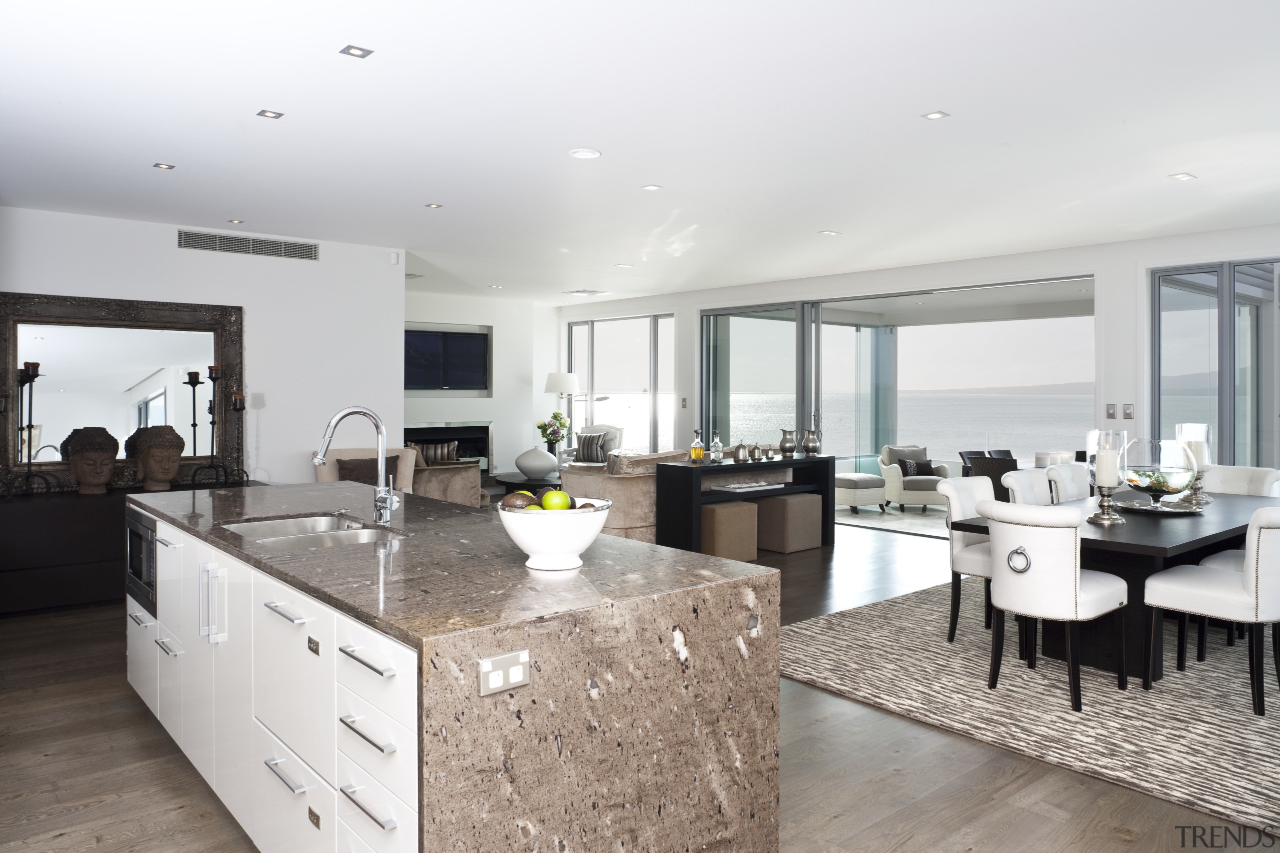 View of kitchen area which features island, granite apartment, countertop, interior design, kitchen, property, real estate, white