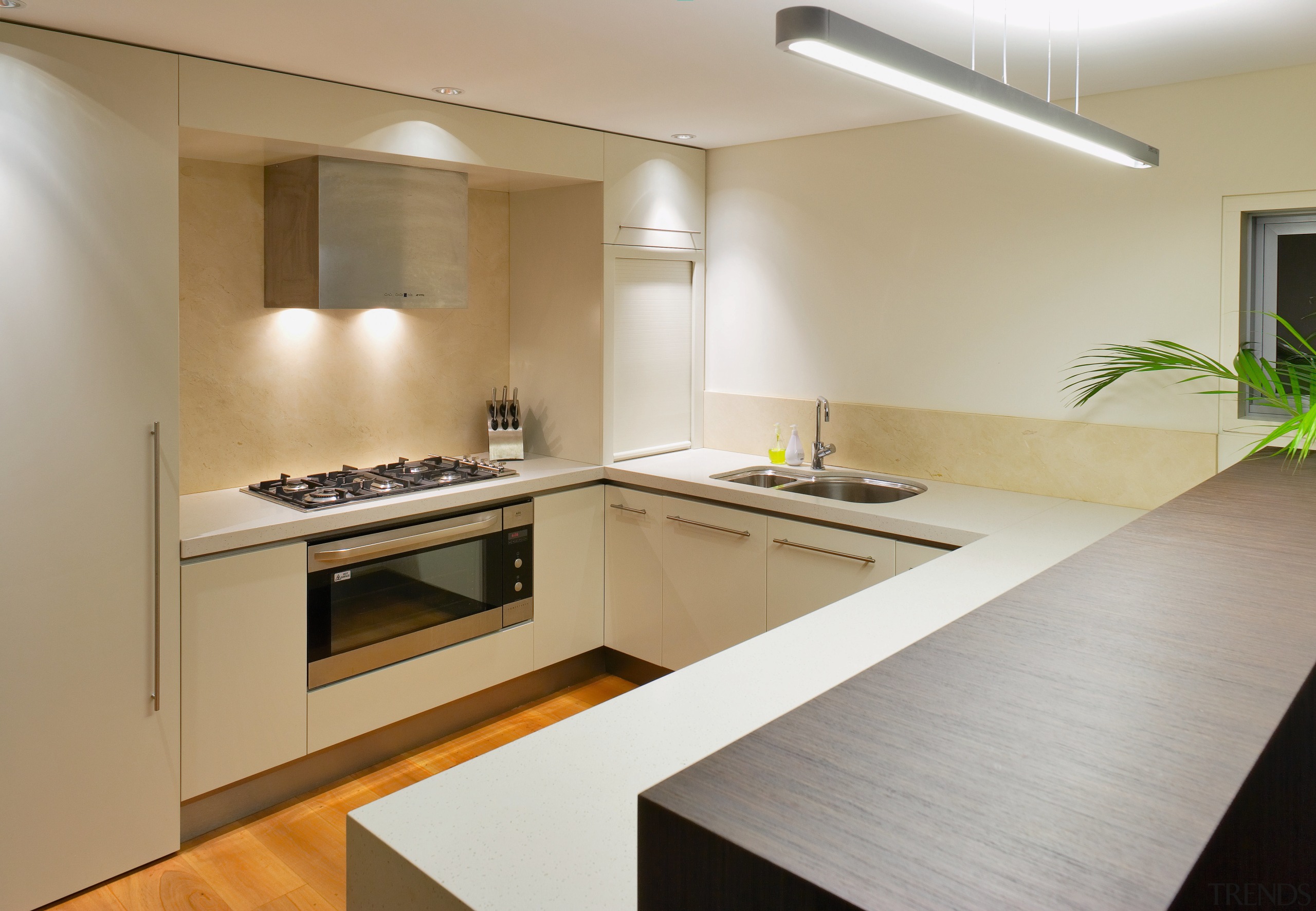 The kitchen is located on the lower floor, countertop, floor, interior design, kitchen, property, real estate, room, gray