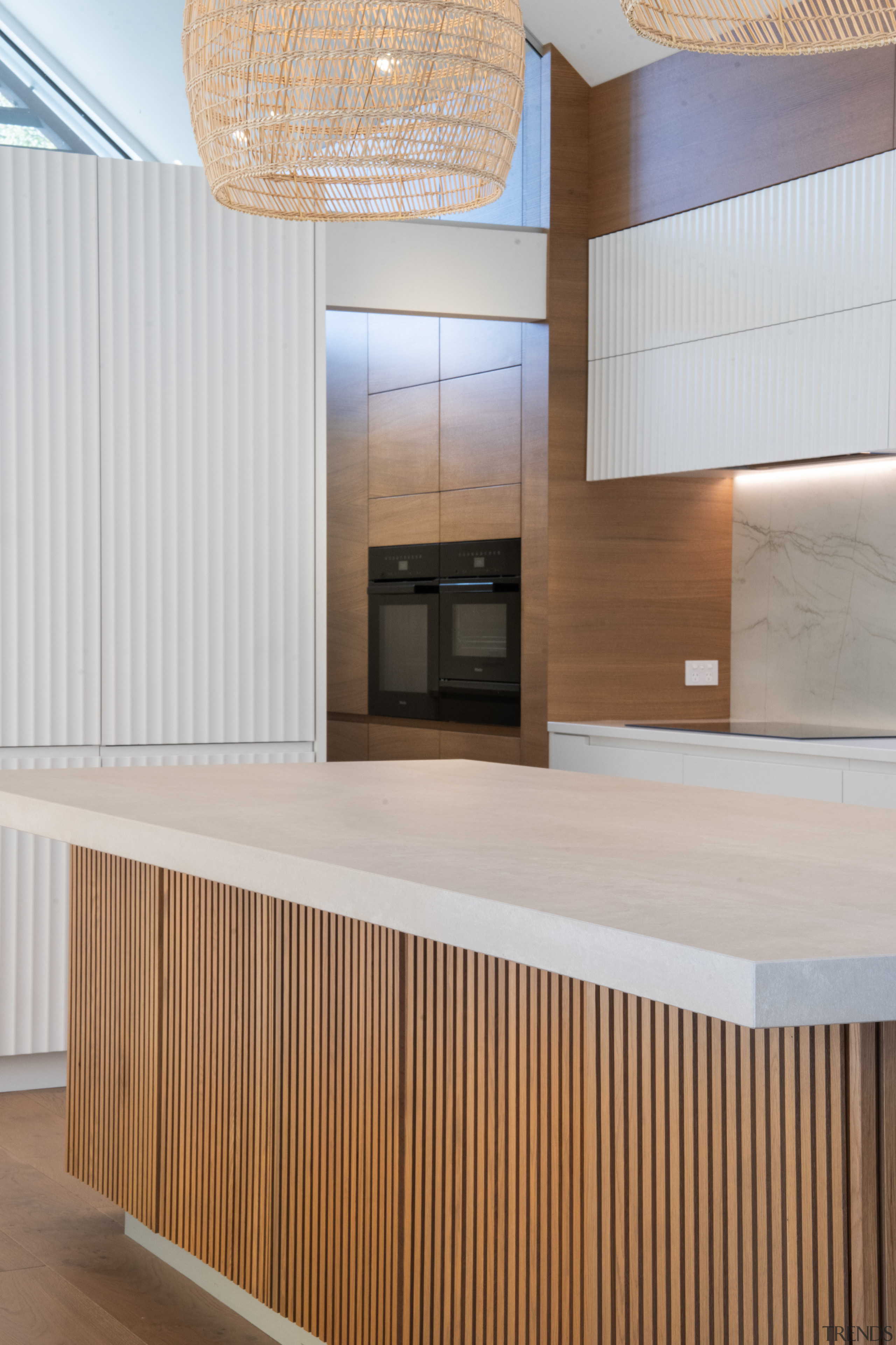 Crenulated cabinet faces on the wall cabinetry are 