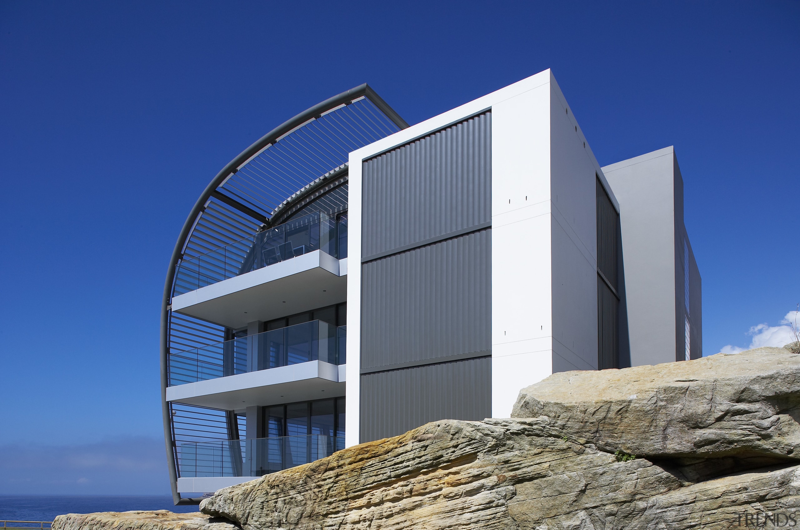 Exterior view of a Sydney apartment building which architecture, building, facade, house, real estate, sky, blue