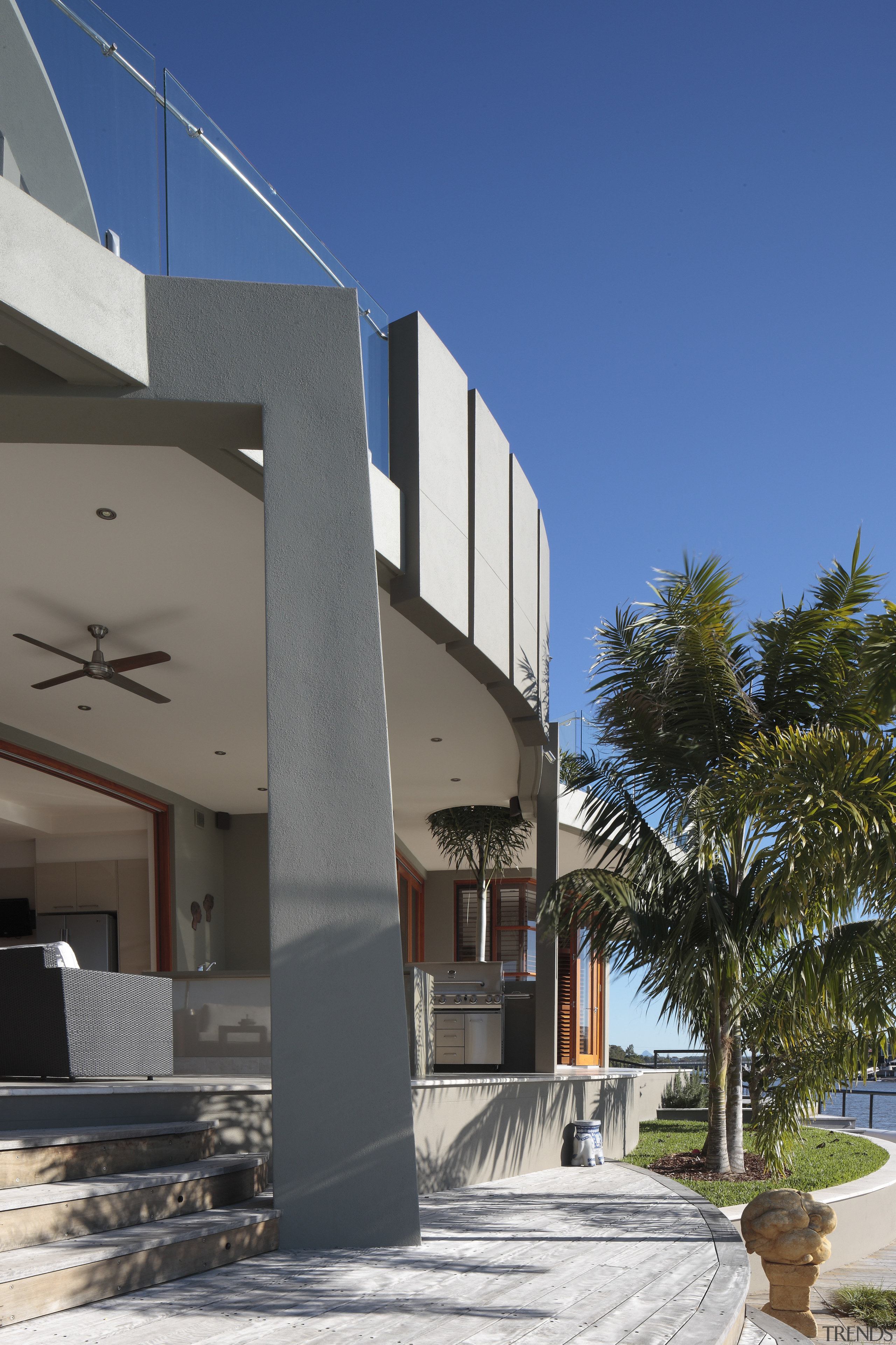 View of the exterior of this contemporary home apartment, architecture, building, condominium, facade, home, house, property, real estate, residential area, sky, blue