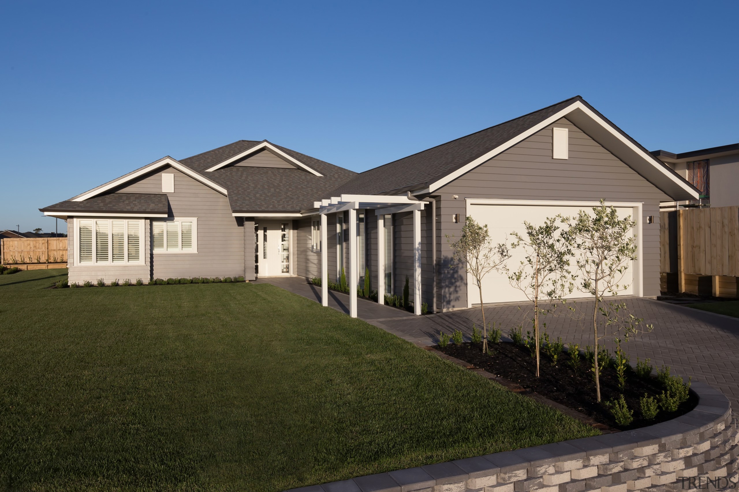 The new Landmark Homes Brookside show home in building, cottage, elevation, estate, facade, farmhouse, grass, home, house, landscape, lawn, property, real estate, residential area, roof, siding, suburb, window, yard, brown, teal