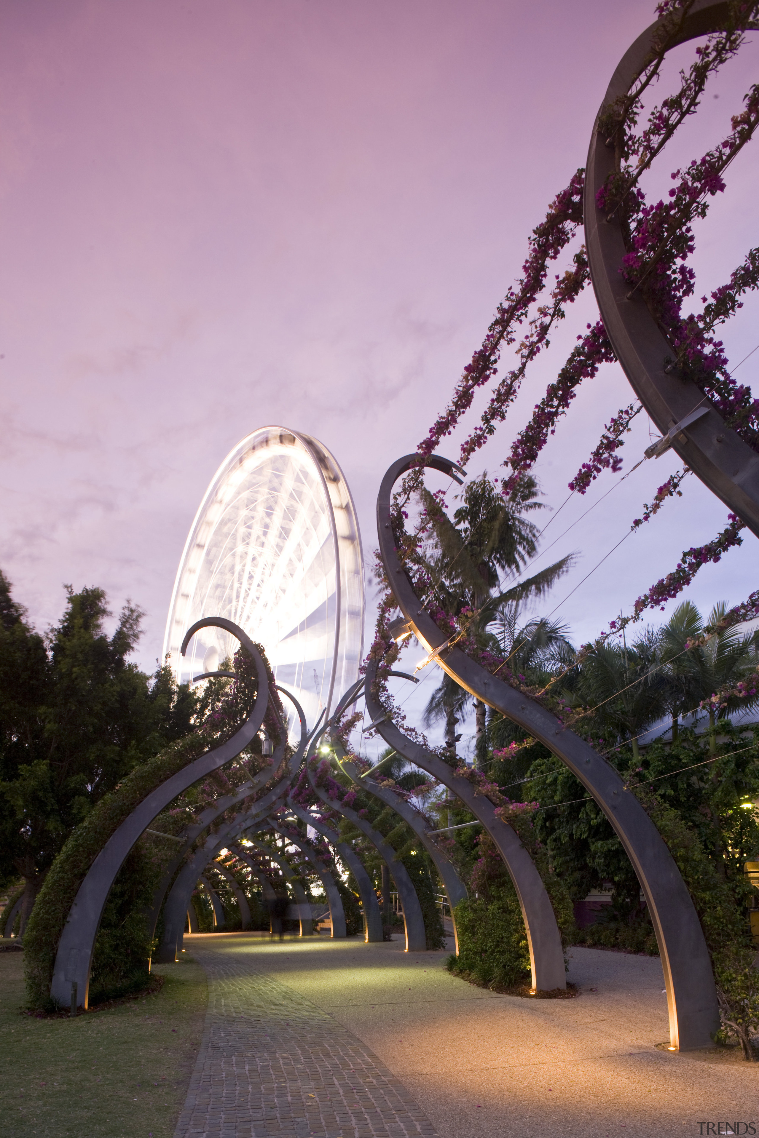 Image of a development which is part of amusement park, architecture, landmark, light, park, reflection, sky, structure, tourist attraction, tree, pink, black