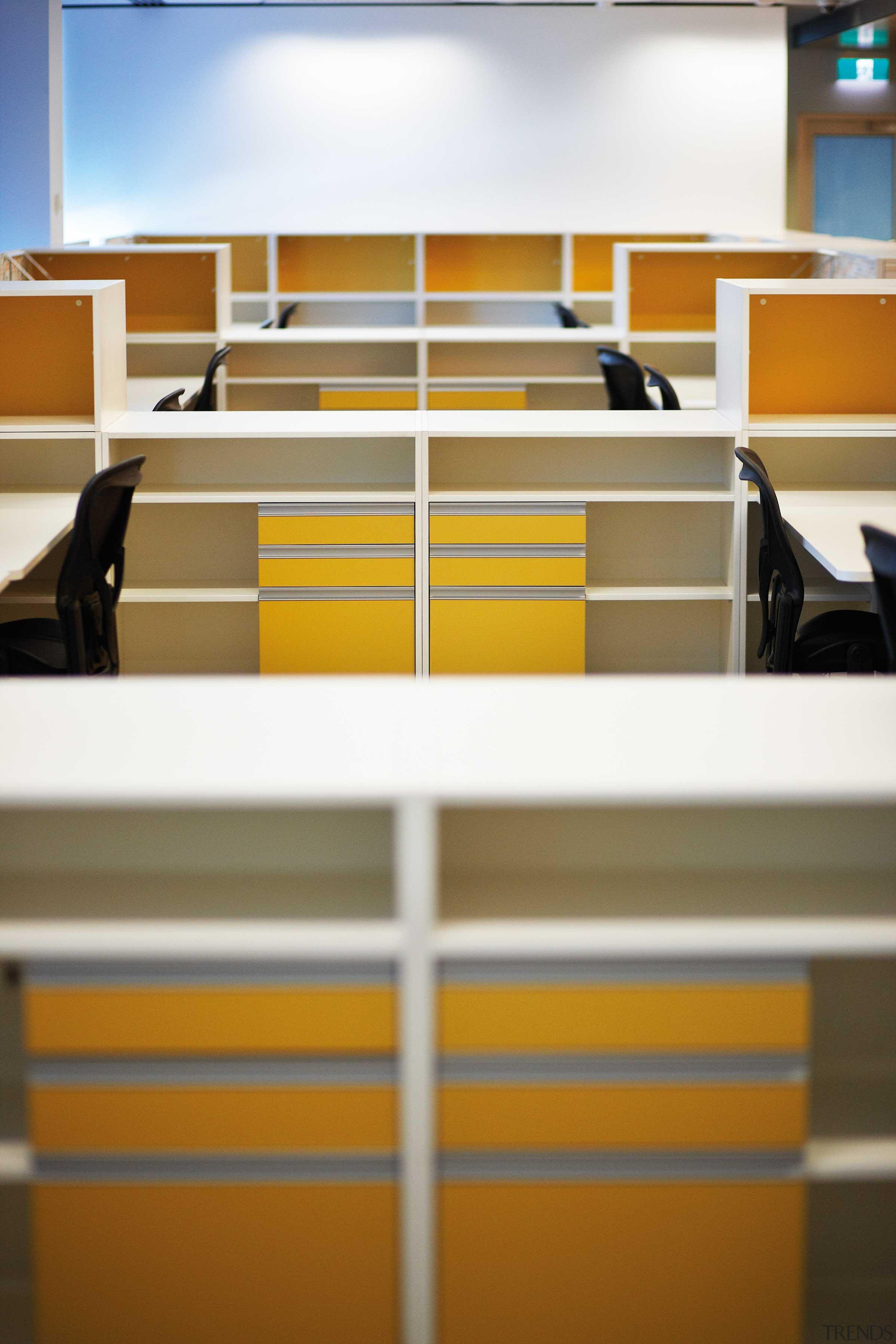 Melteca is used for cubicle division and other angle, floor, furniture, line, office, product, shelf, shelving, yellow, brown, white