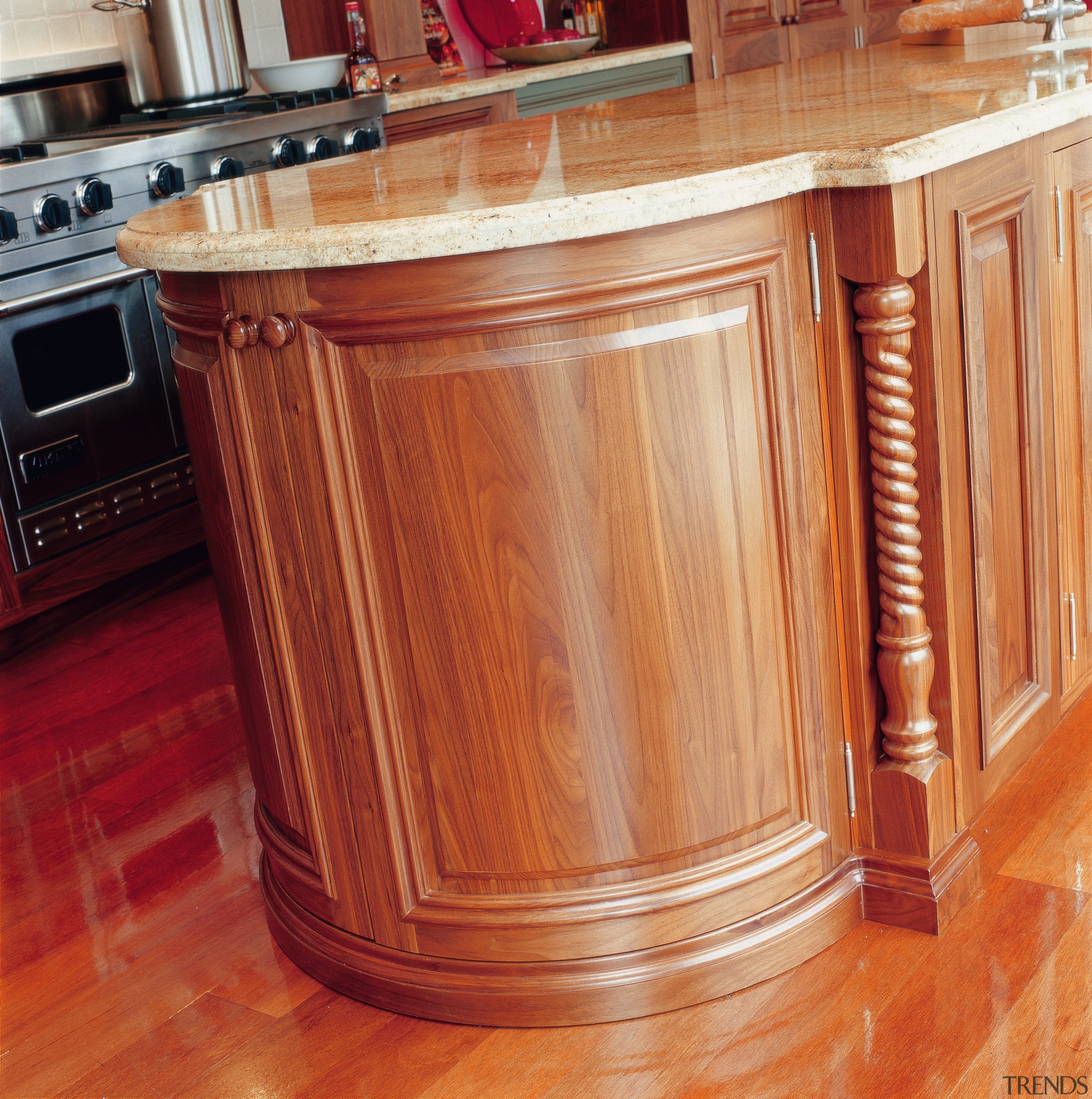 view of the custom designed timber kitchen cabinetry cabinetry, chest of drawers, countertop, cupboard, desk, drawer, floor, flooring, furniture, hardwood, kitchen, laminate flooring, sideboard, table, wood, wood flooring, wood stain, red, orange