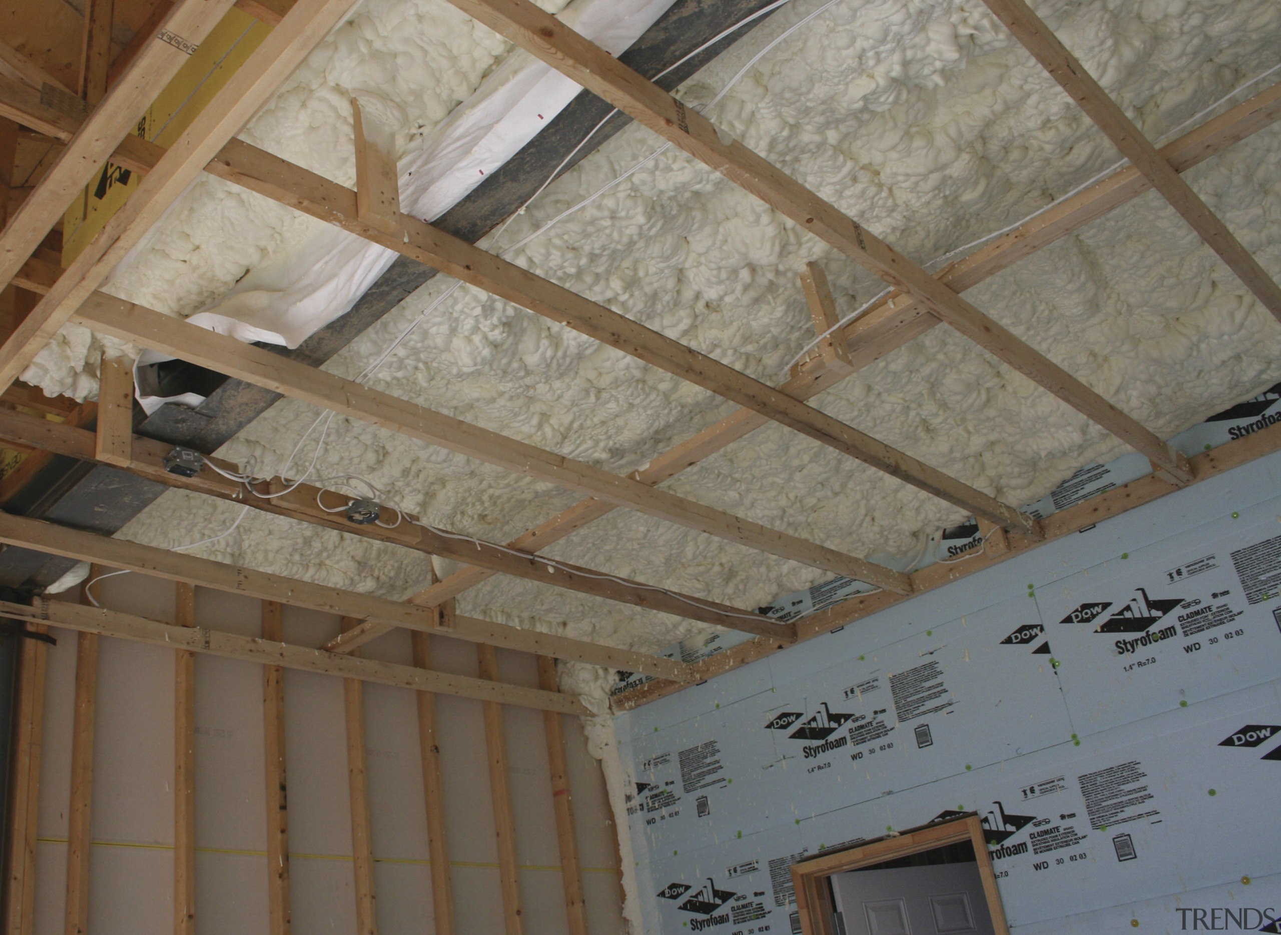 Icynene Spray Foam starts of as a liqquid beam, ceiling, daylighting, floor, roof, structure, wall, wood, gray, brown