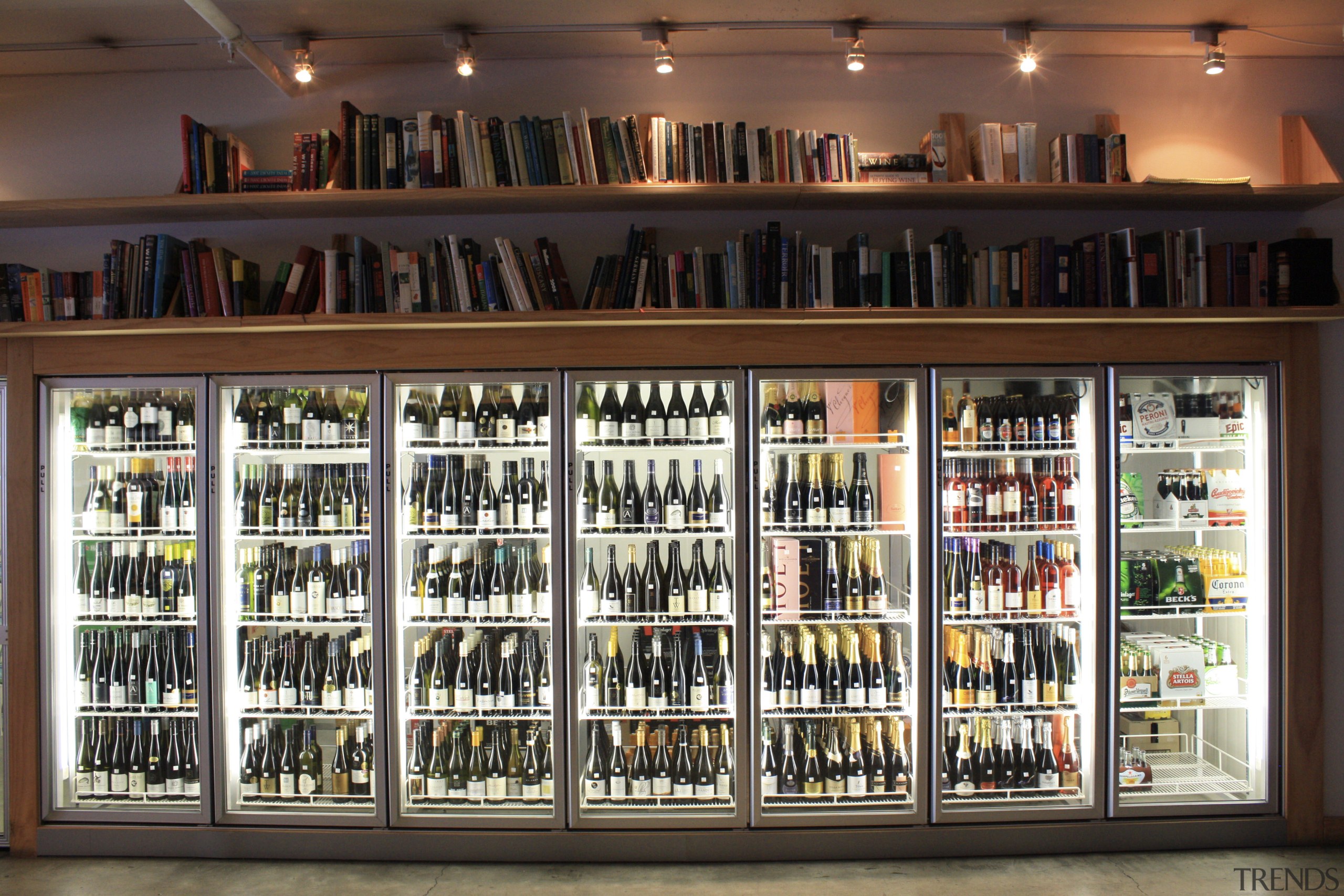 View of refrigeration solution at wine retailer. - bookcase, display case, liquor store, shelving, black