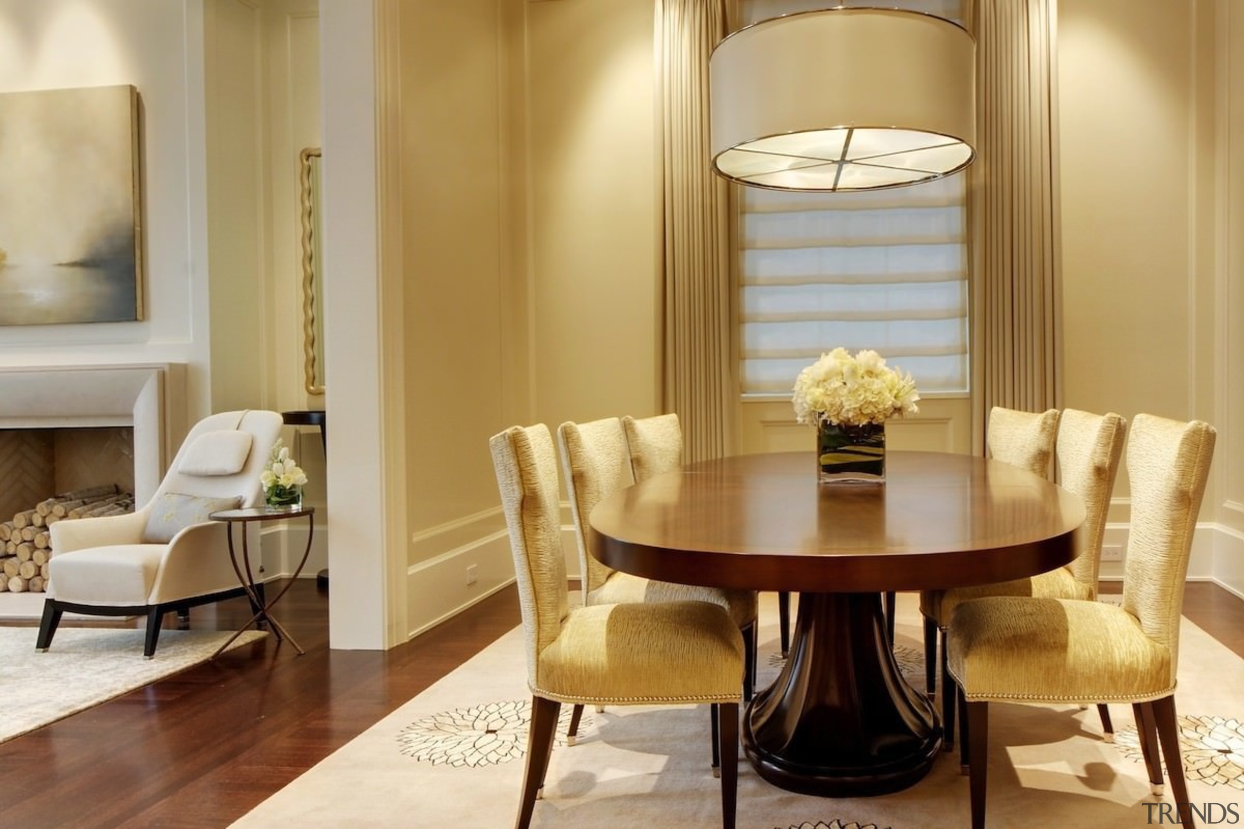 An expansive dining room opens out into the ceiling, chair, dining room, furniture, home, interior design, living room, room, suite, table, orange, brown