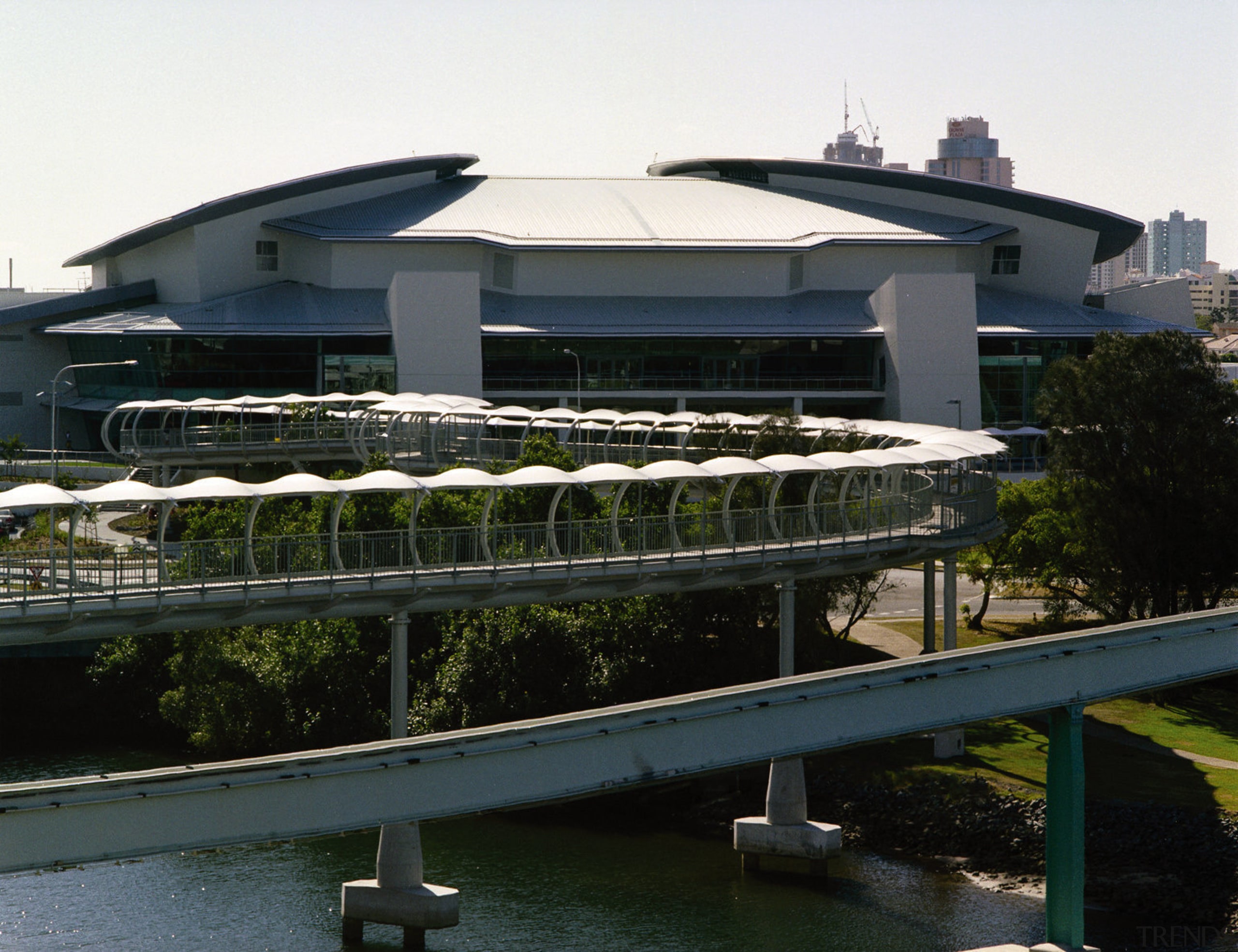 Exterior view of complex showing its low profile, architecture, building, corporate headquarters, marina, passenger ship, real estate, structure, water, waterway, black, white