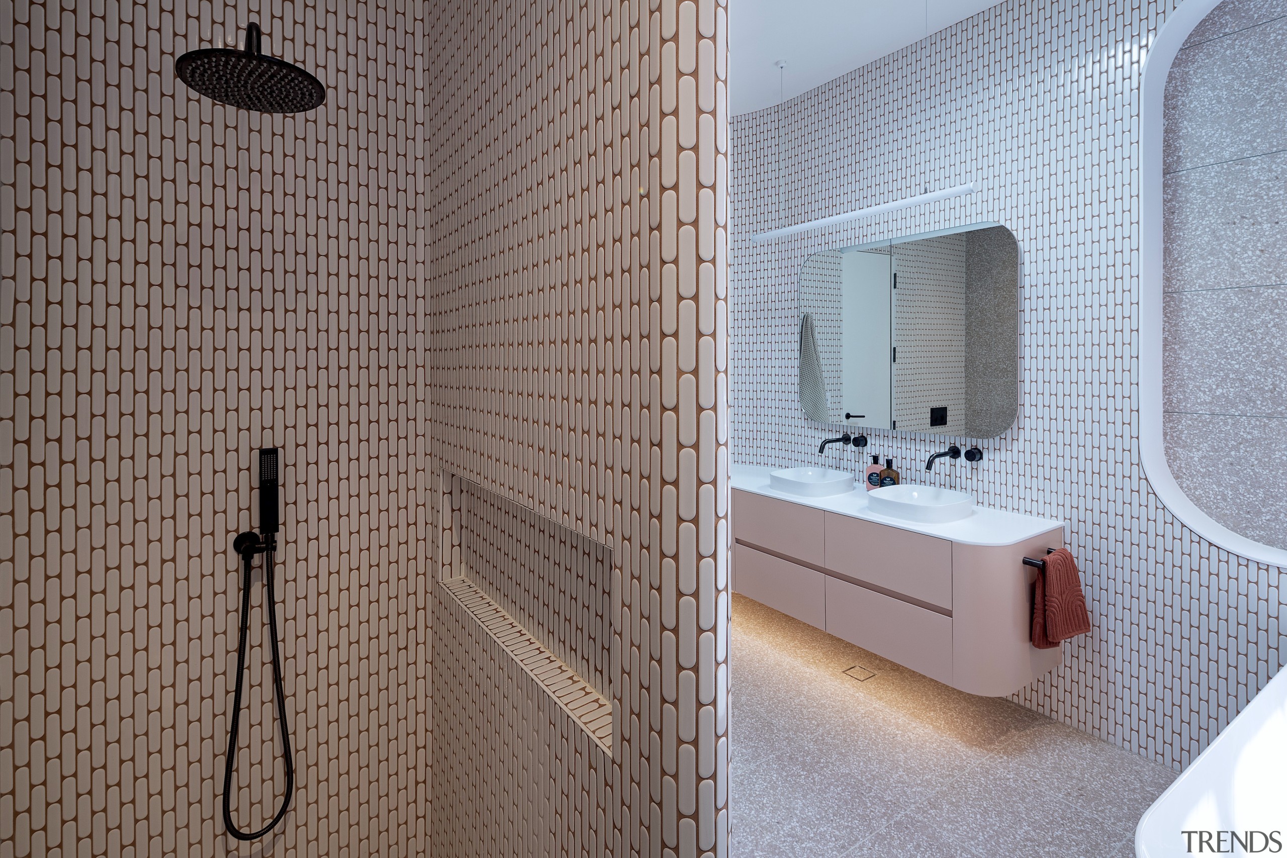 The bathroom makes a playful nod to both 