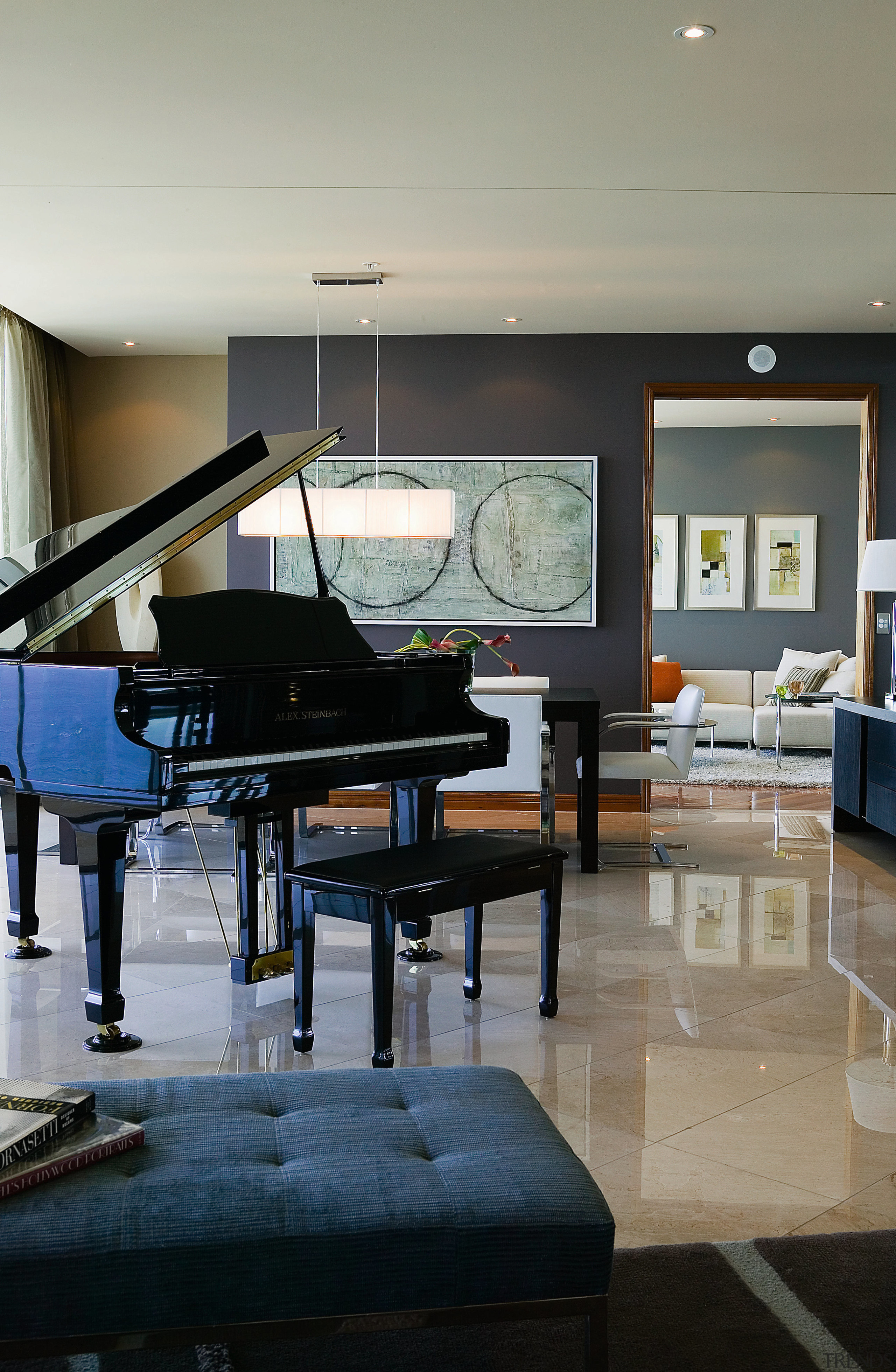 view of the living area featuring tiled flooring, floor, flooring, furniture, interior design, keyboard, living room, piano, room, table, gray, black