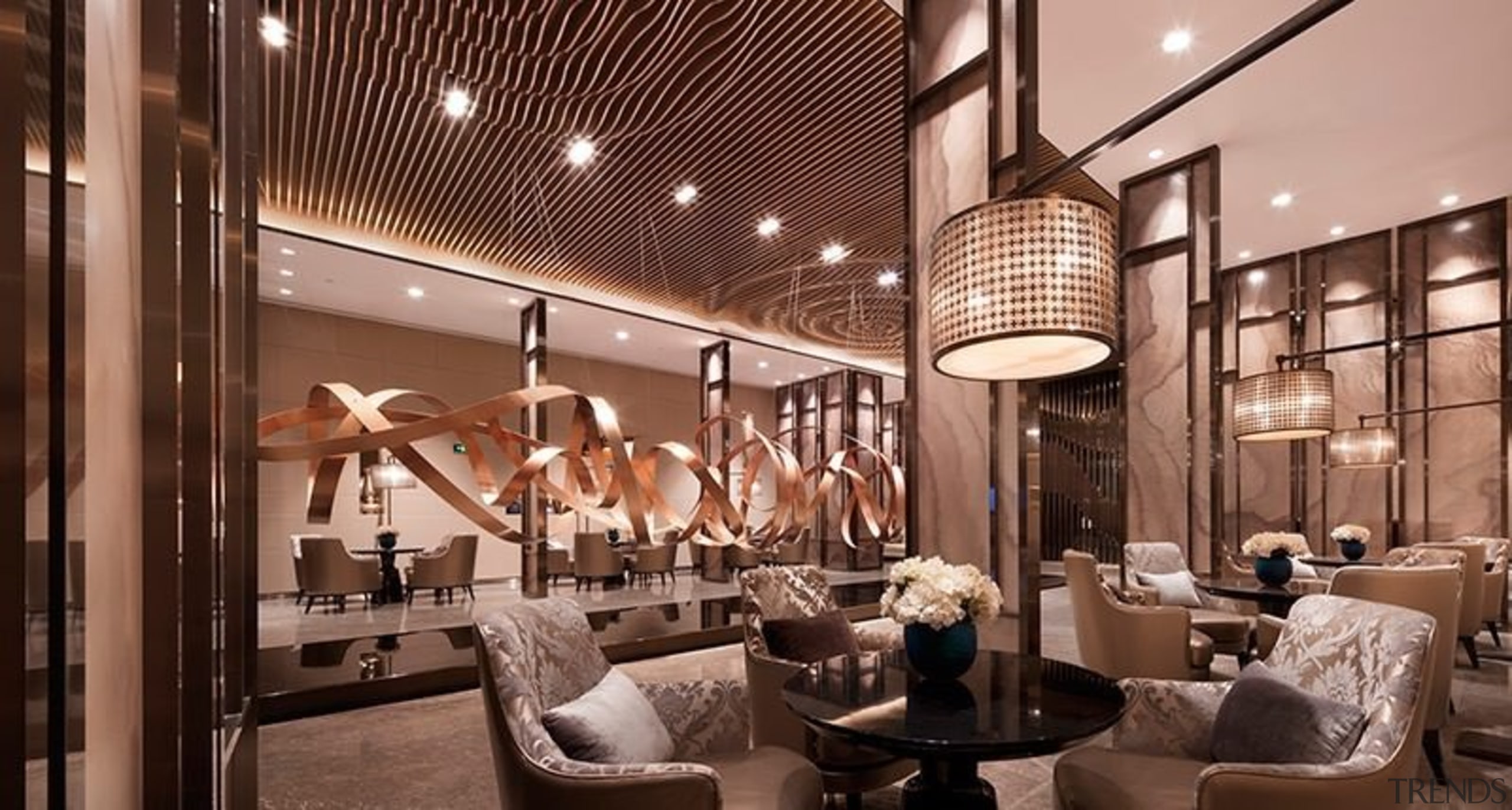 This lobby features an impressive sculpture running along interior design, lobby, brown, orange