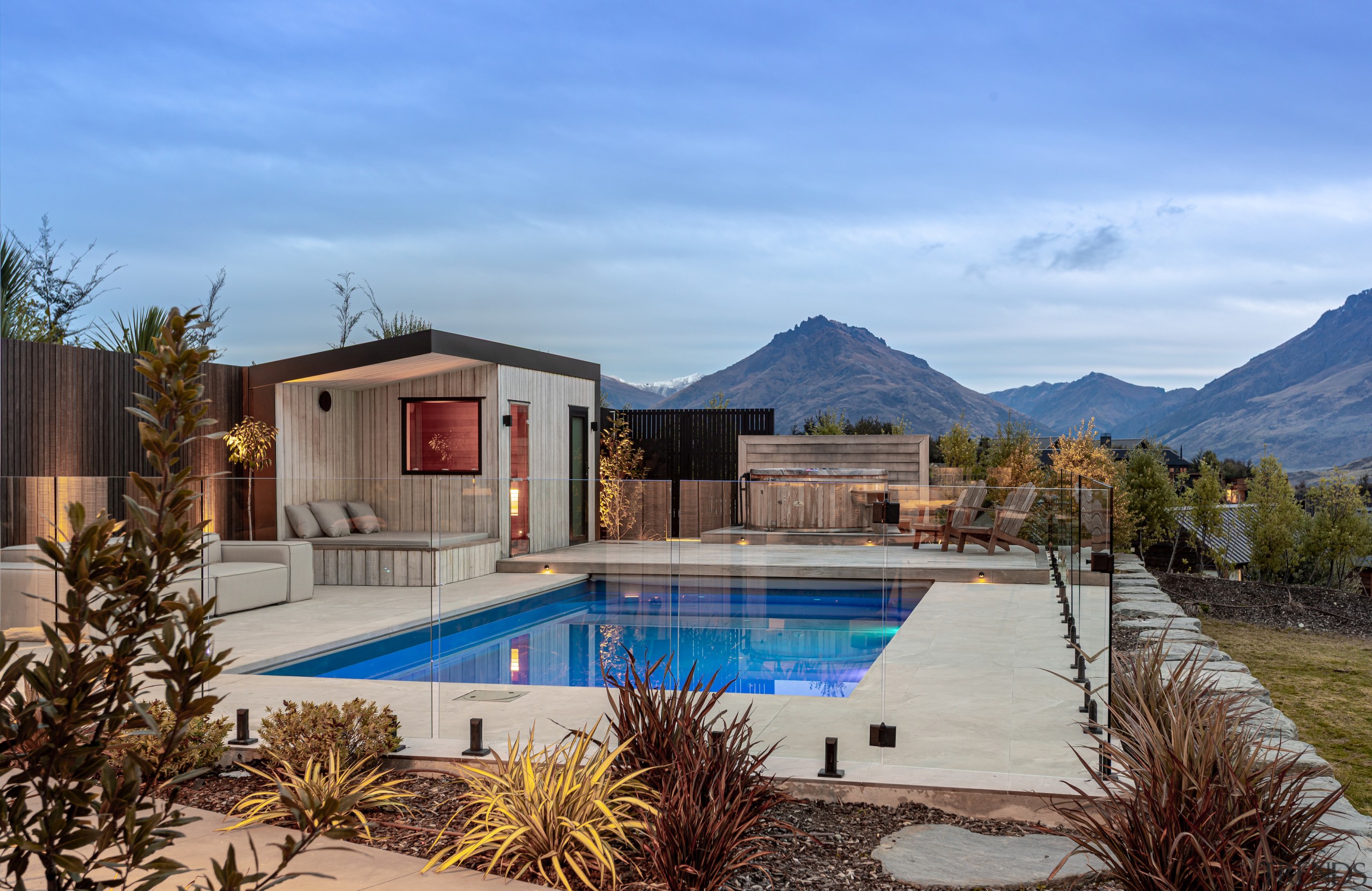 Pool and pool house with mountains behind. - 