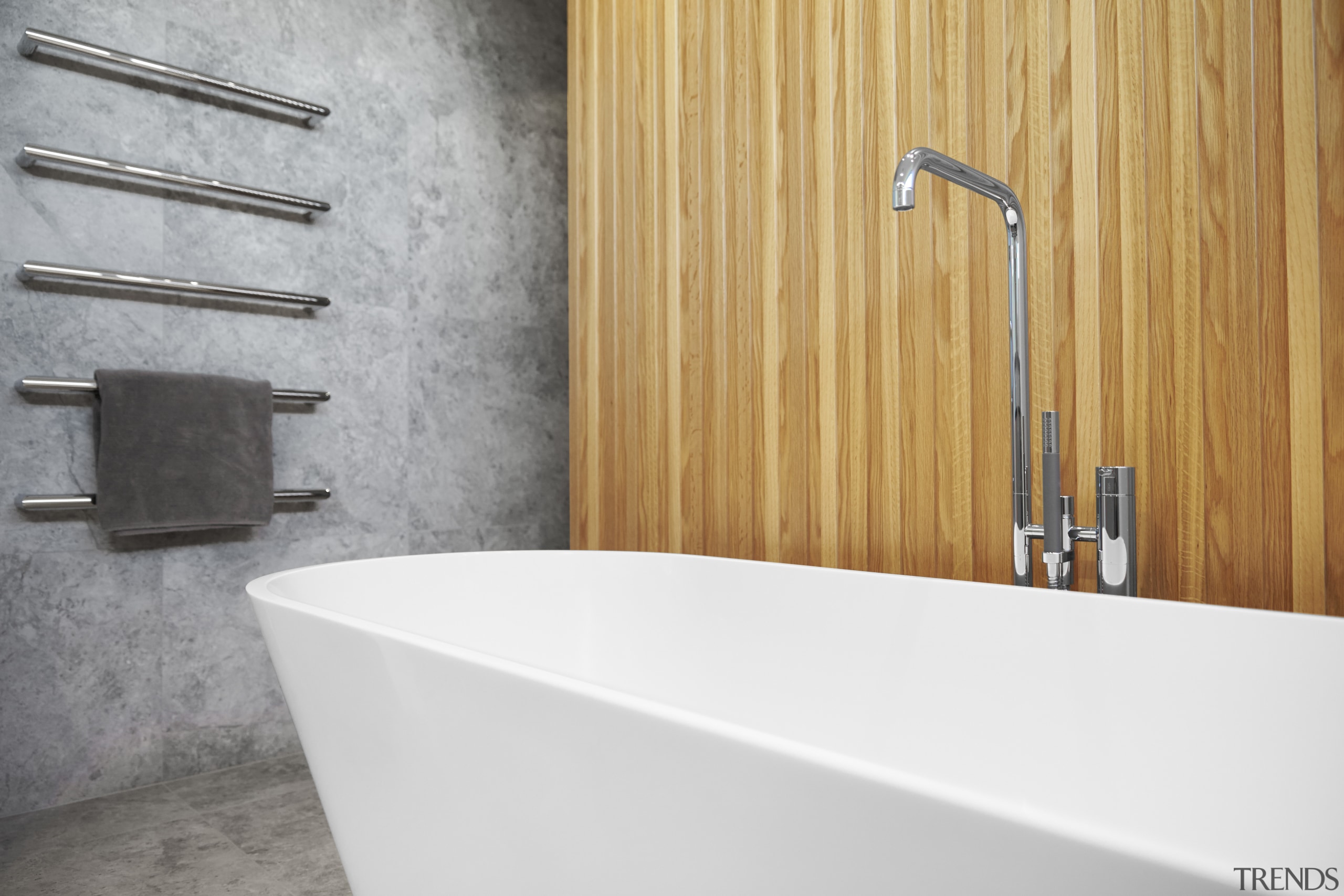 The sculptural bath tub is set off by bathroom, bathroom sink, plumbing fixture, sink, tap, tile, wall, white, gray, orange