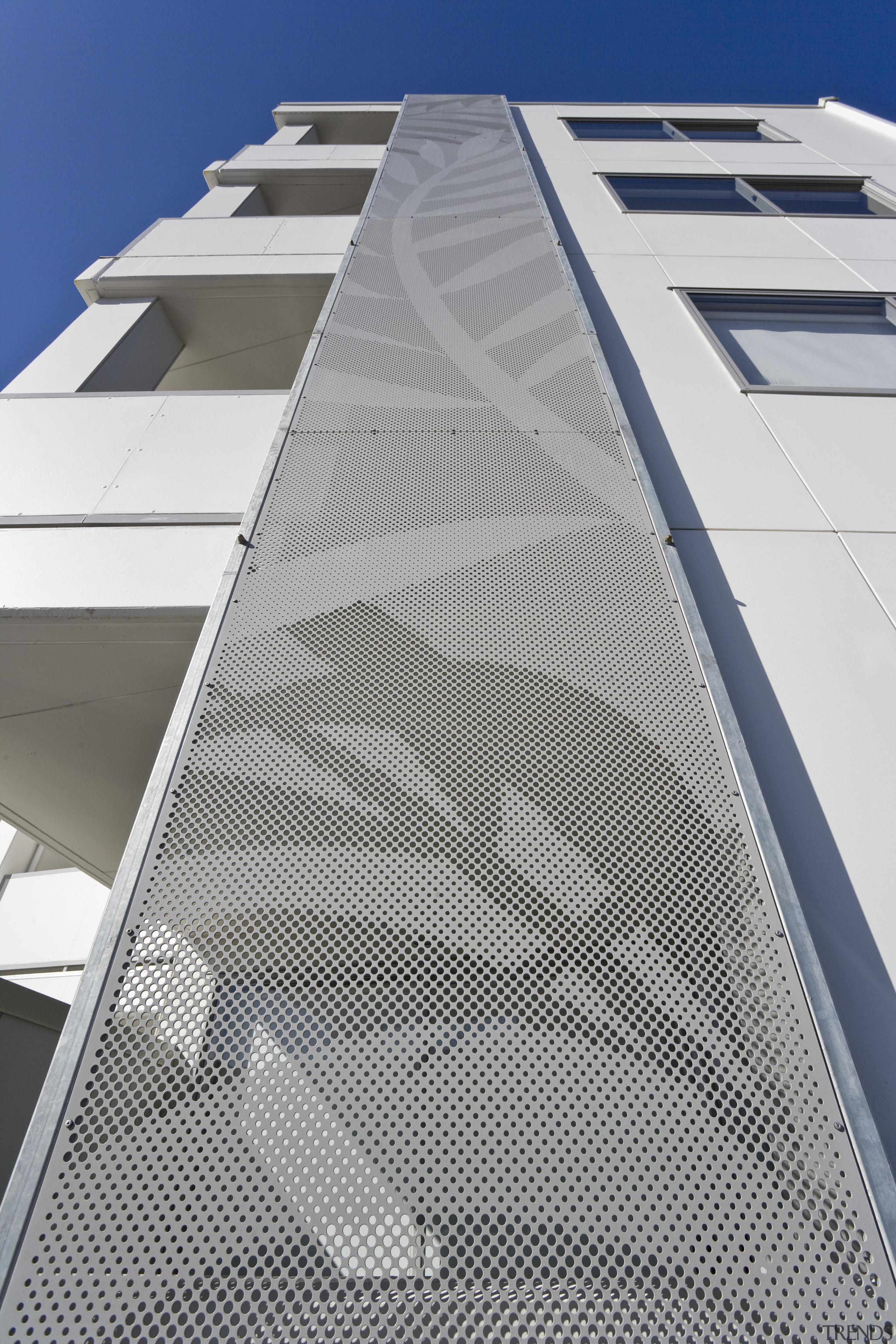 Exterior view of the Ivory apartments which features angle, architecture, building, commercial building, daylighting, daytime, facade, line, product design, structure, gray