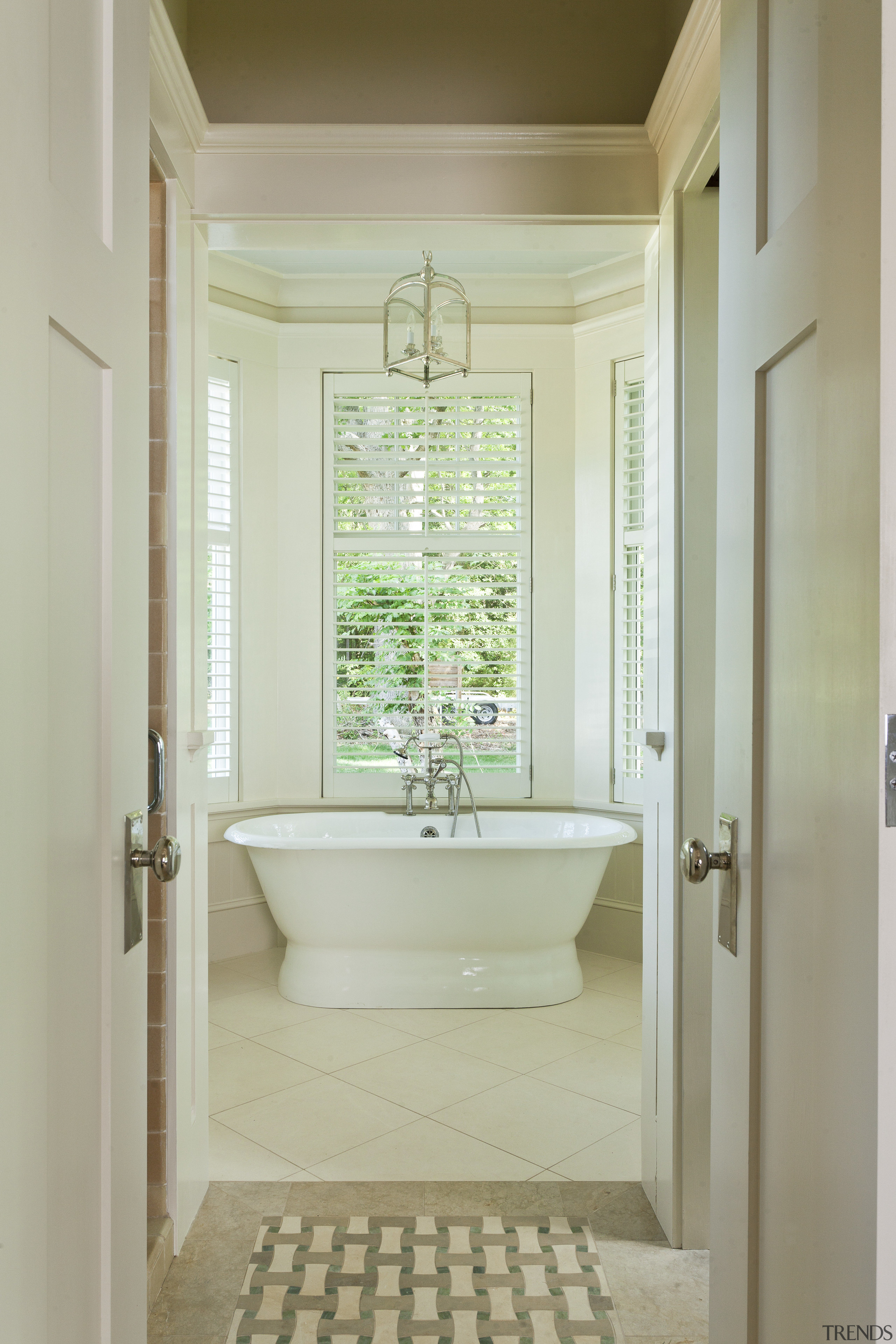 In this traditional, shingle-style house, the master bathroom bathroom, daylighting, estate, floor, home, interior design, plumbing fixture, real estate, room, tile, window, yellow