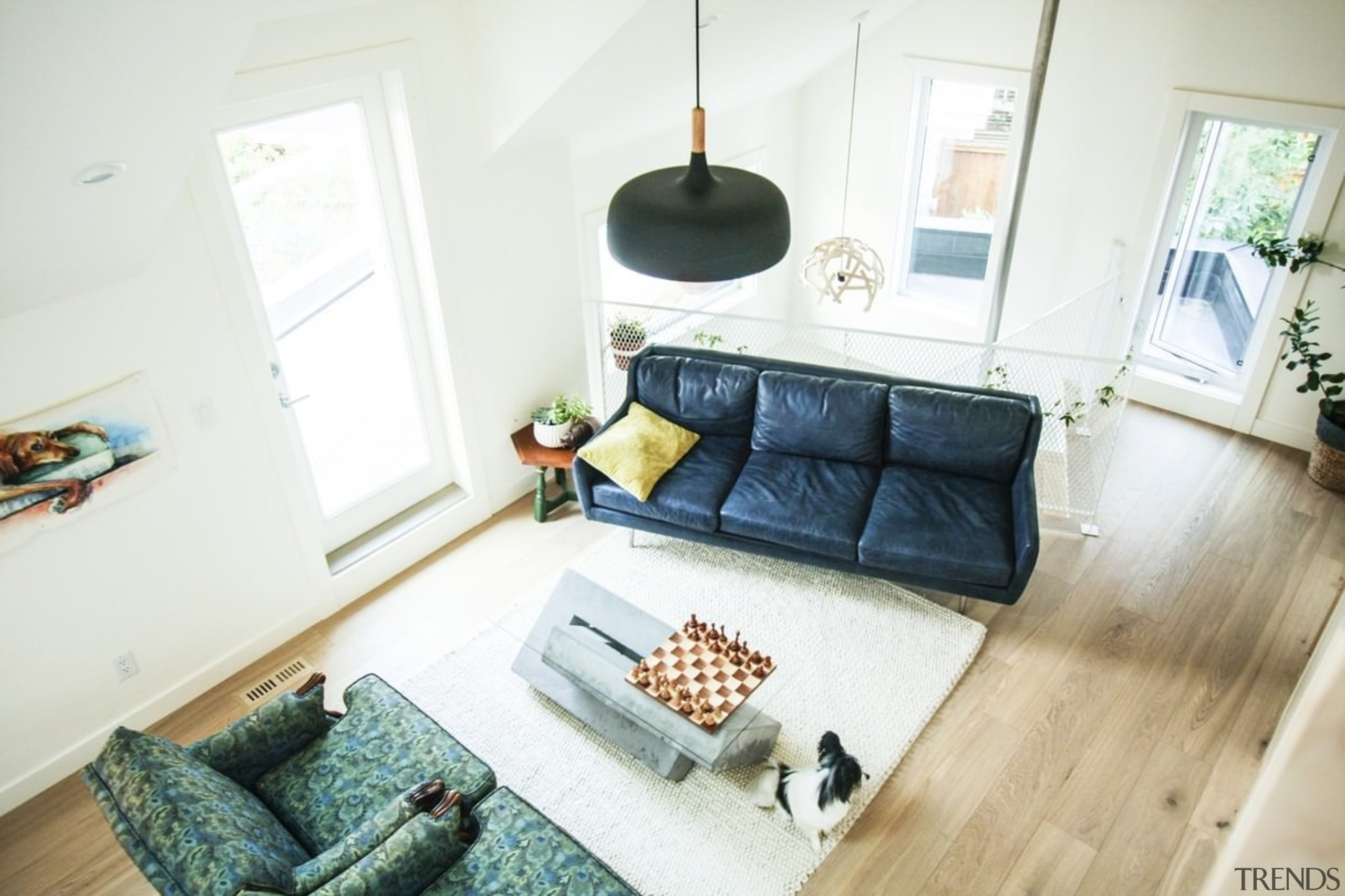 A view down into the lounge - A couch, floor, furniture, home, house, interior design, living room, property, room, table, wood, white