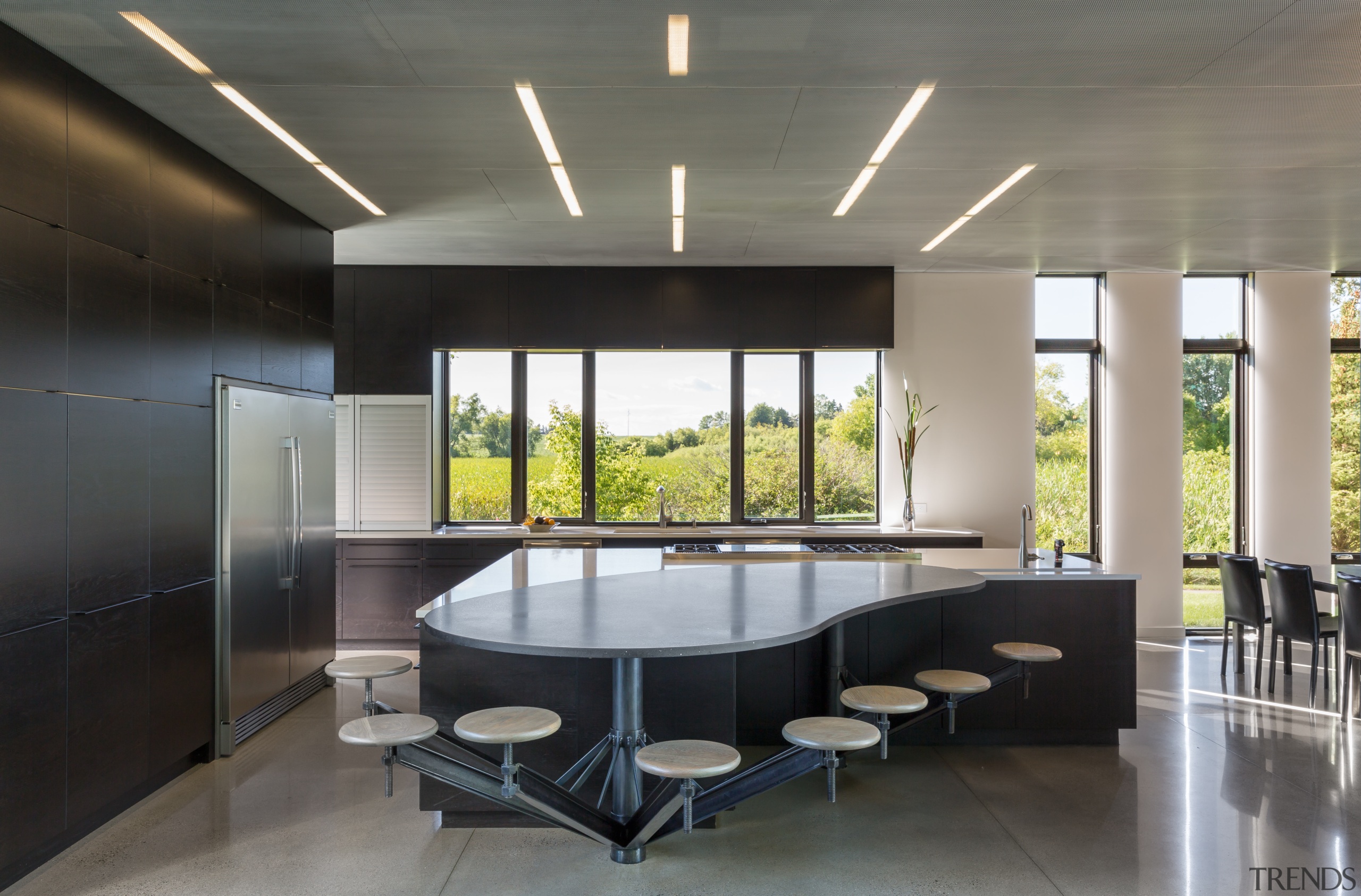 ​​​​​​​This kitchen’s informal seating area is shaped to architecture, interior design, custom table, Altus Architecture