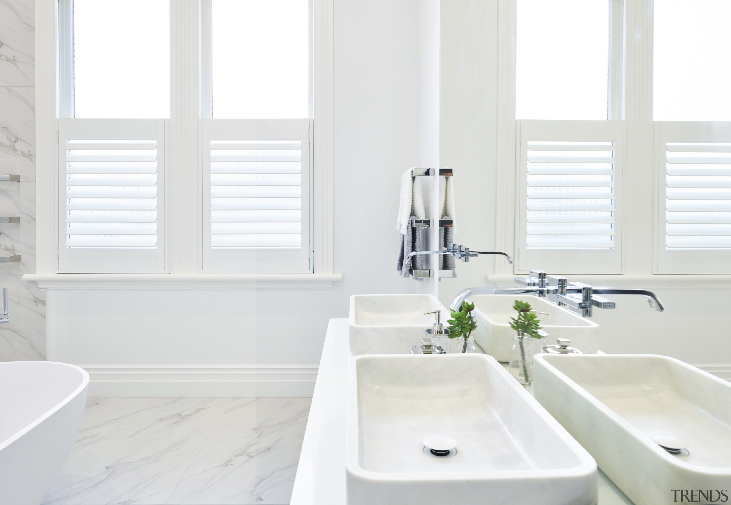 Curves of the sculptural tub complement the modern, bathroom, bathroom accessory, bathroom sink, home, interior design, plumbing fixture, product, product design, room, sink, tap, window, white