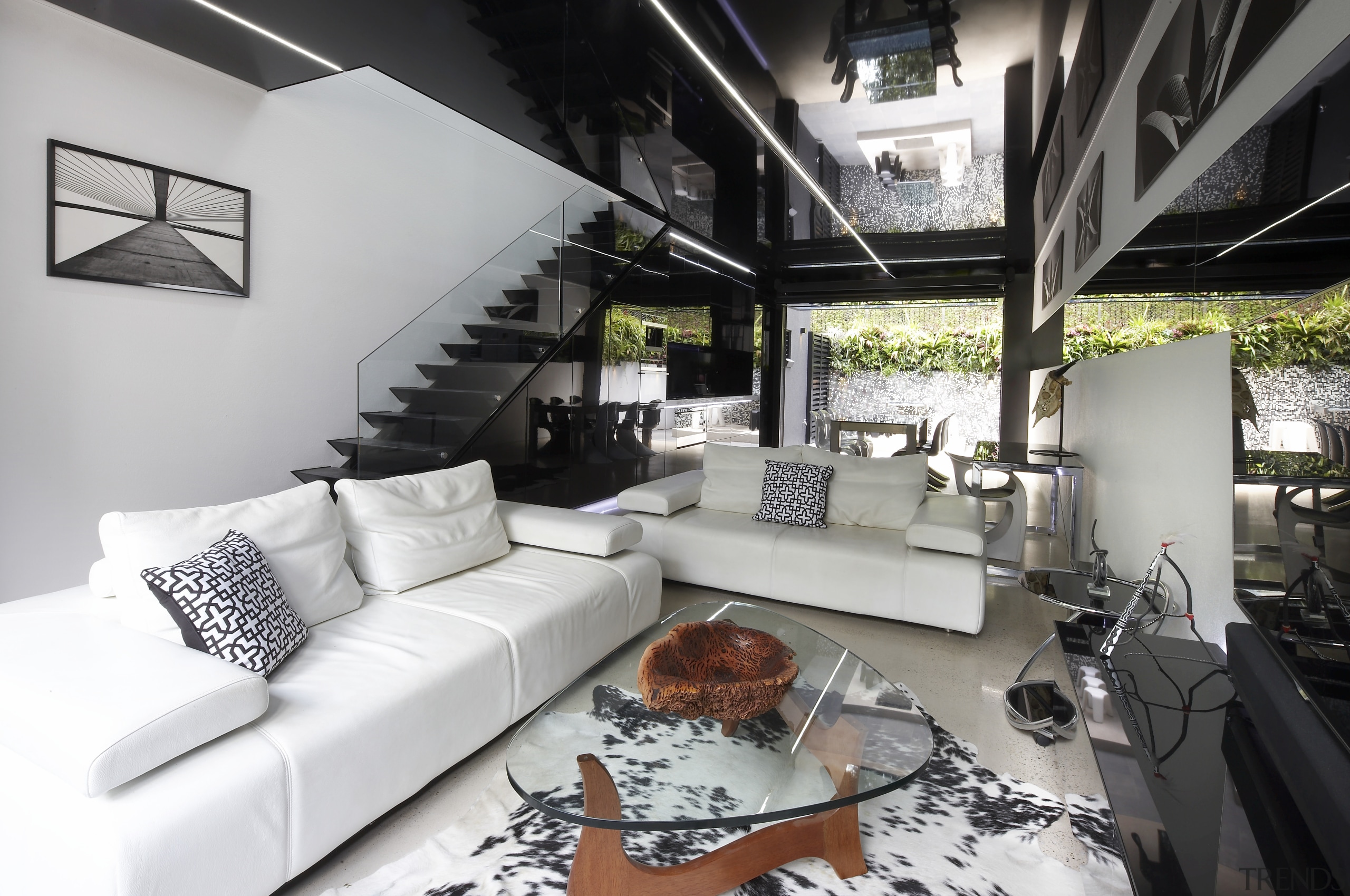 This new terrace house has a black and home, house, interior design, living room, loft, property, white, black, gray