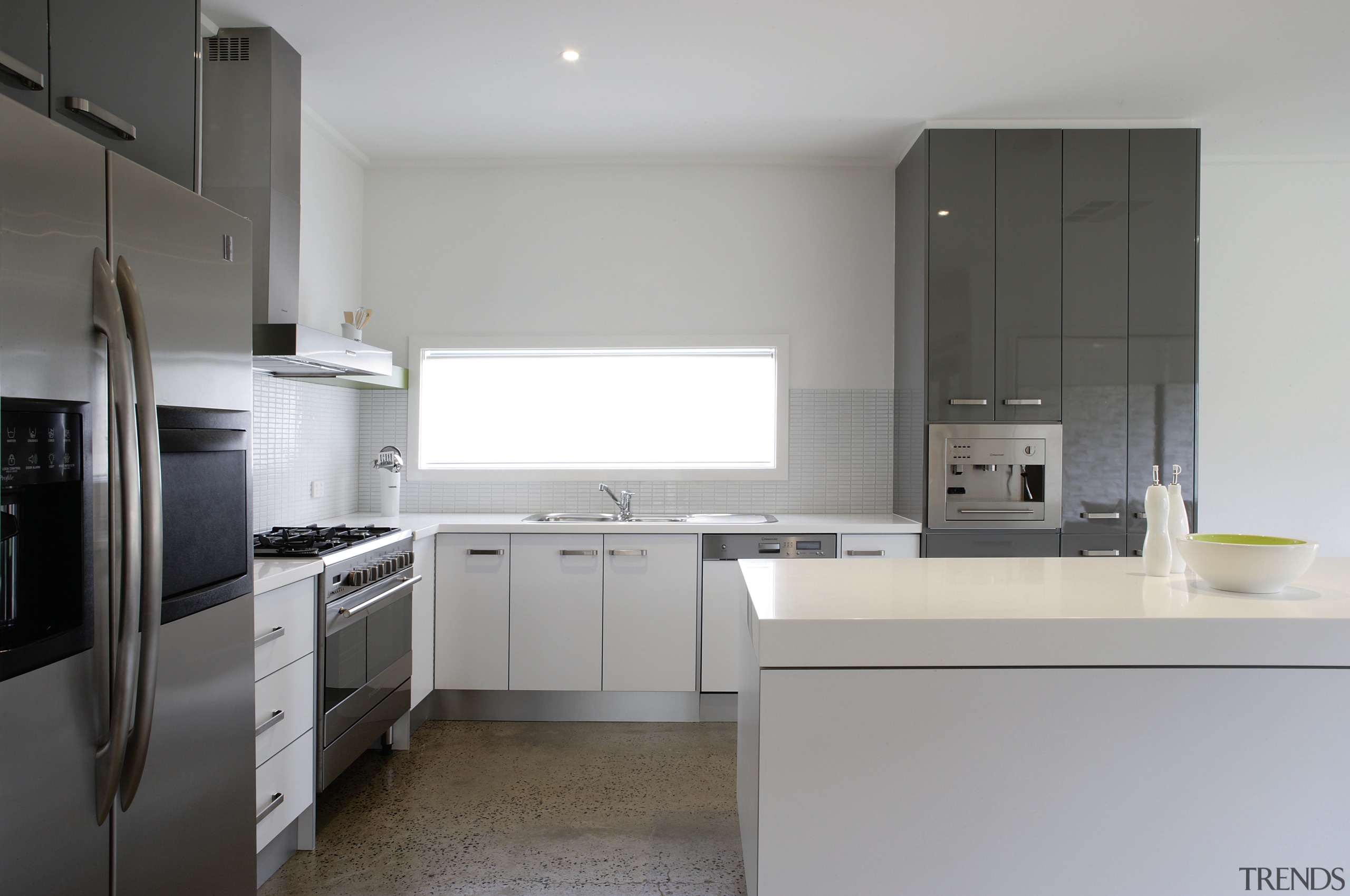 Kitchen with cream cabinetry and stainless steel appliances. countertop, home appliance, kitchen, real estate, room, gray