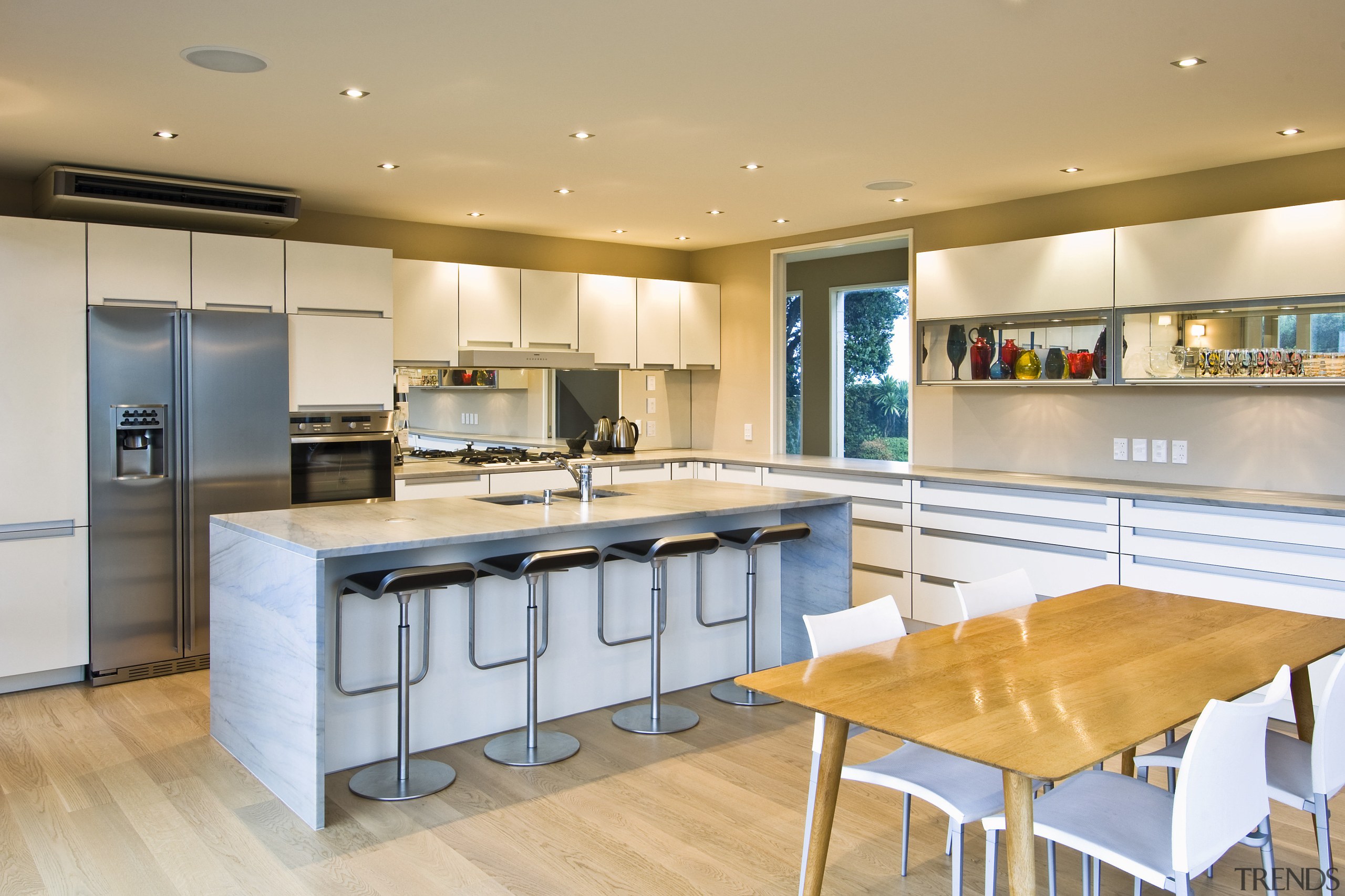 View of kitchen which has been designed by countertop, interior design, kitchen, real estate, room, orange, gray