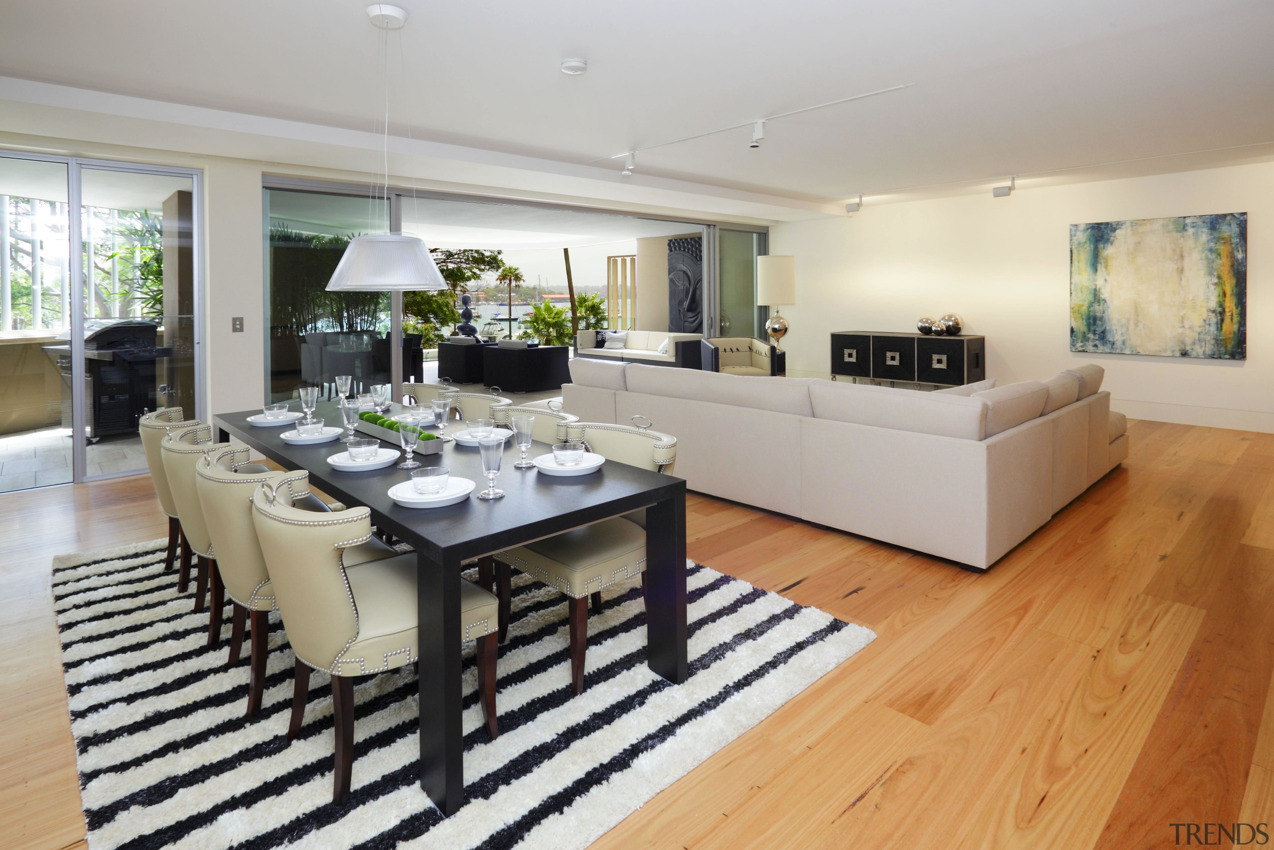 View of open-plan living and dining area which floor, flooring, hardwood, interior design, kitchen, living room, property, real estate, room, wood flooring, gray