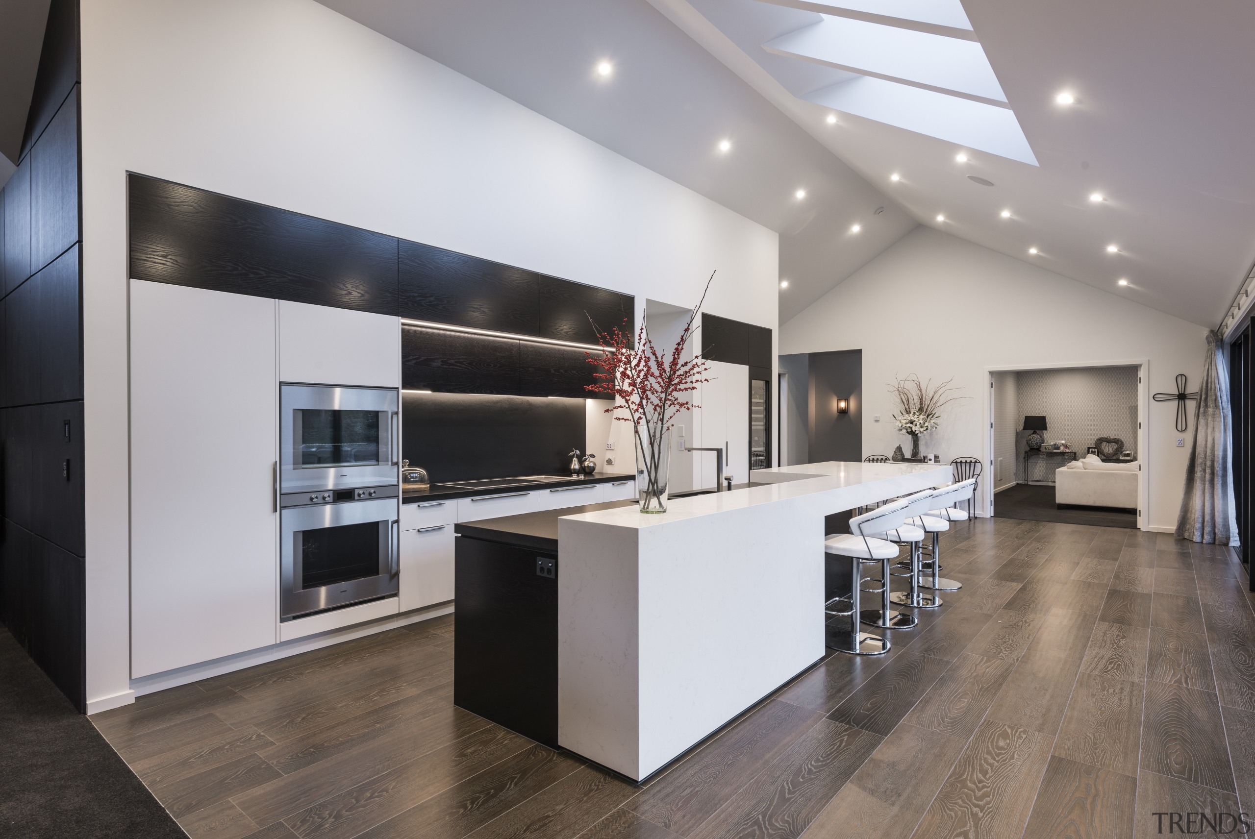 A stepped countertop helps evoke the spatial features countertop, floor, flooring, interior design, kitchen, gray