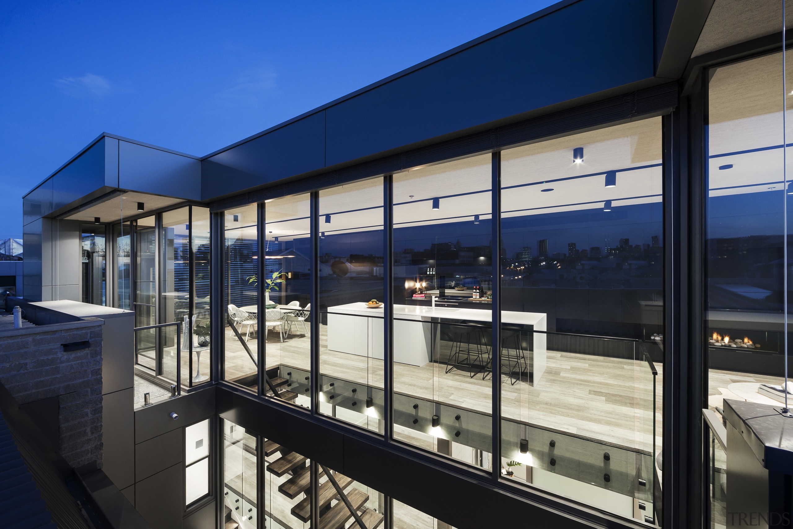 This long, narrow apartment rises above its industrial architecture, building, corporate headquarters, facade, real estate, window, black, blue