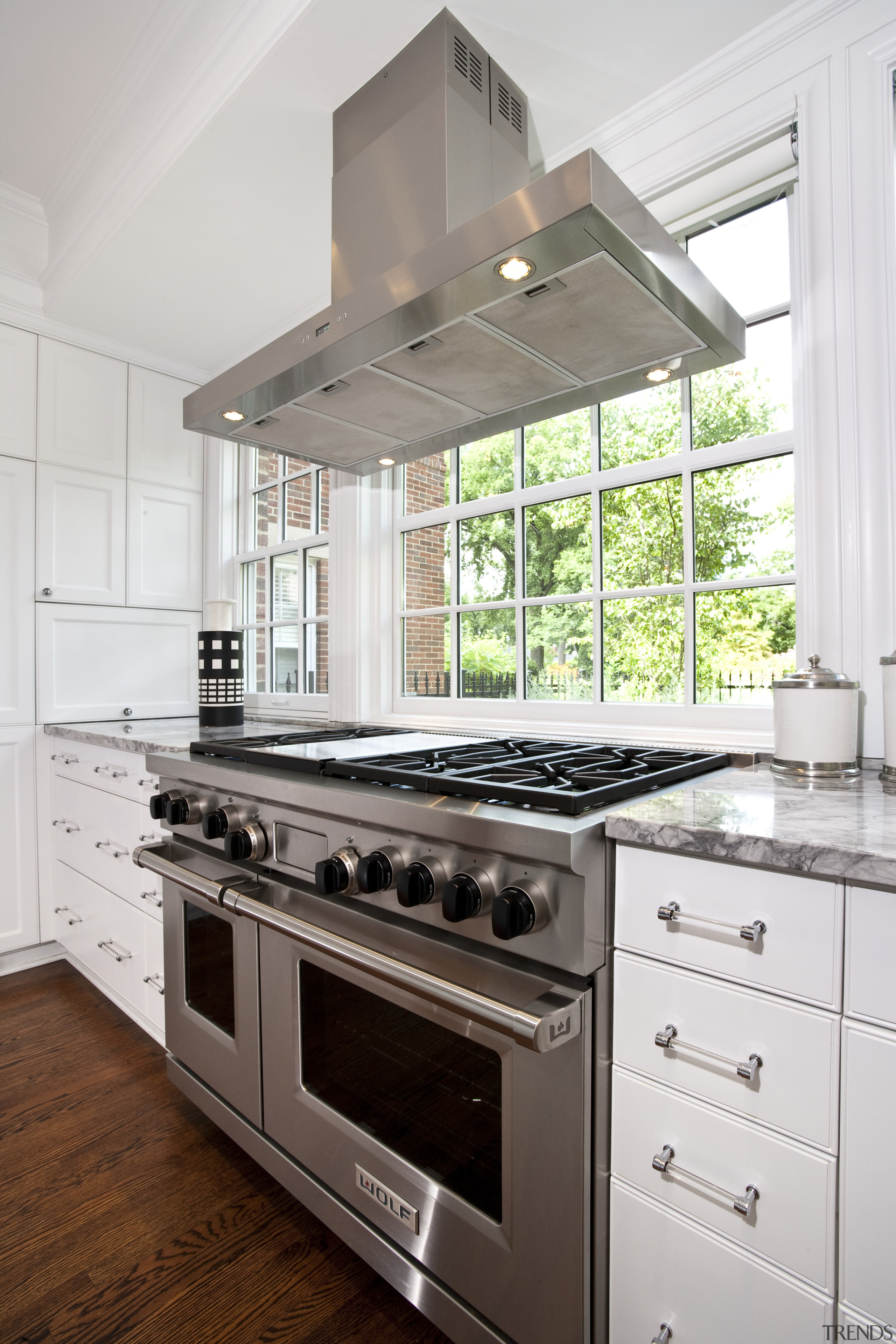 A view of a kitchen by Julie Hacker cabinetry, countertop, cuisine classique, floor, home appliance, interior design, kitchen, kitchen appliance, kitchen stove, white