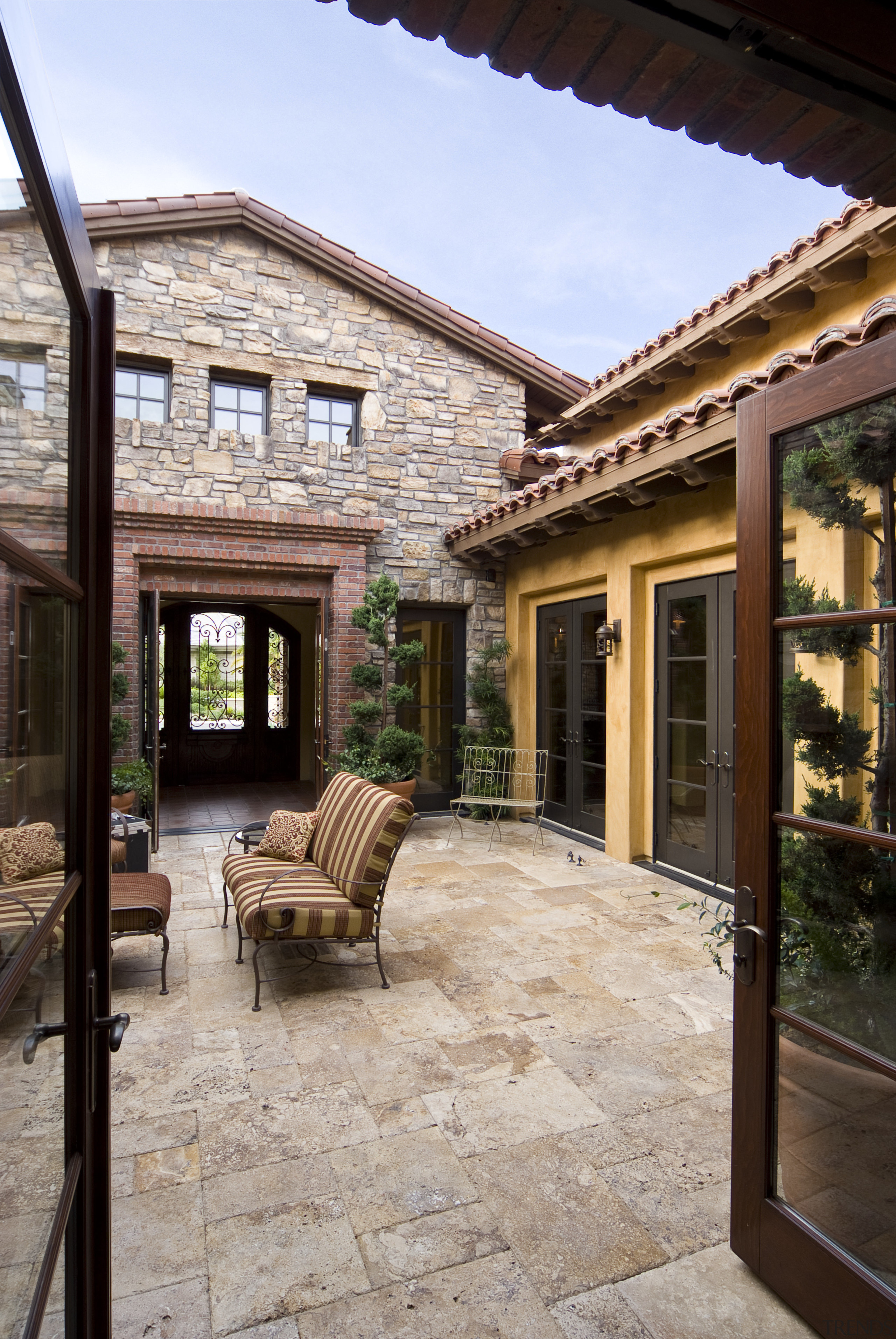 Exterior view of the enclosed courtyard at this courtyard, estate, facade, home, house, outdoor structure, patio, property, real estate, window, gray, black