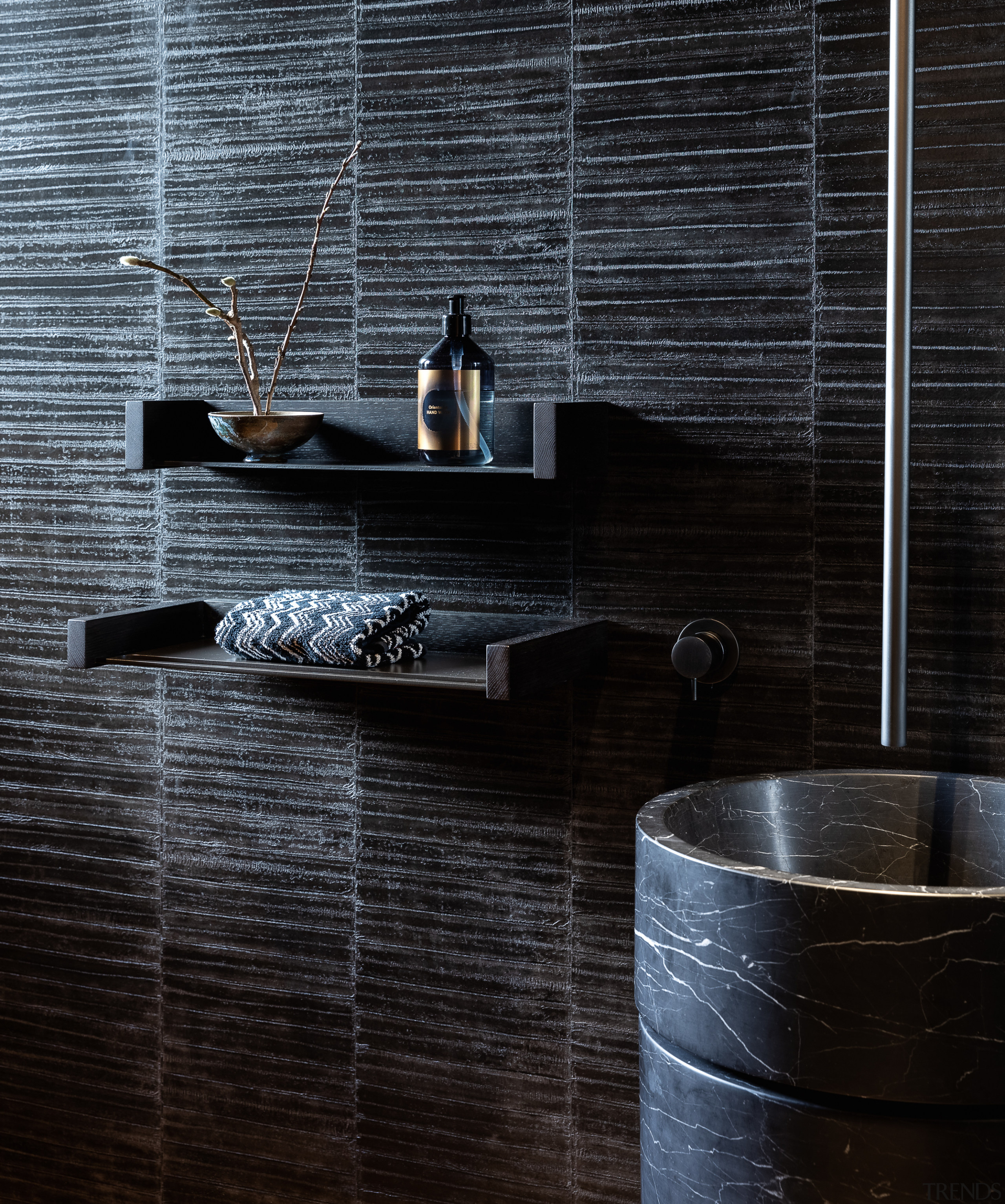 Black detailing complements the use of black marble 