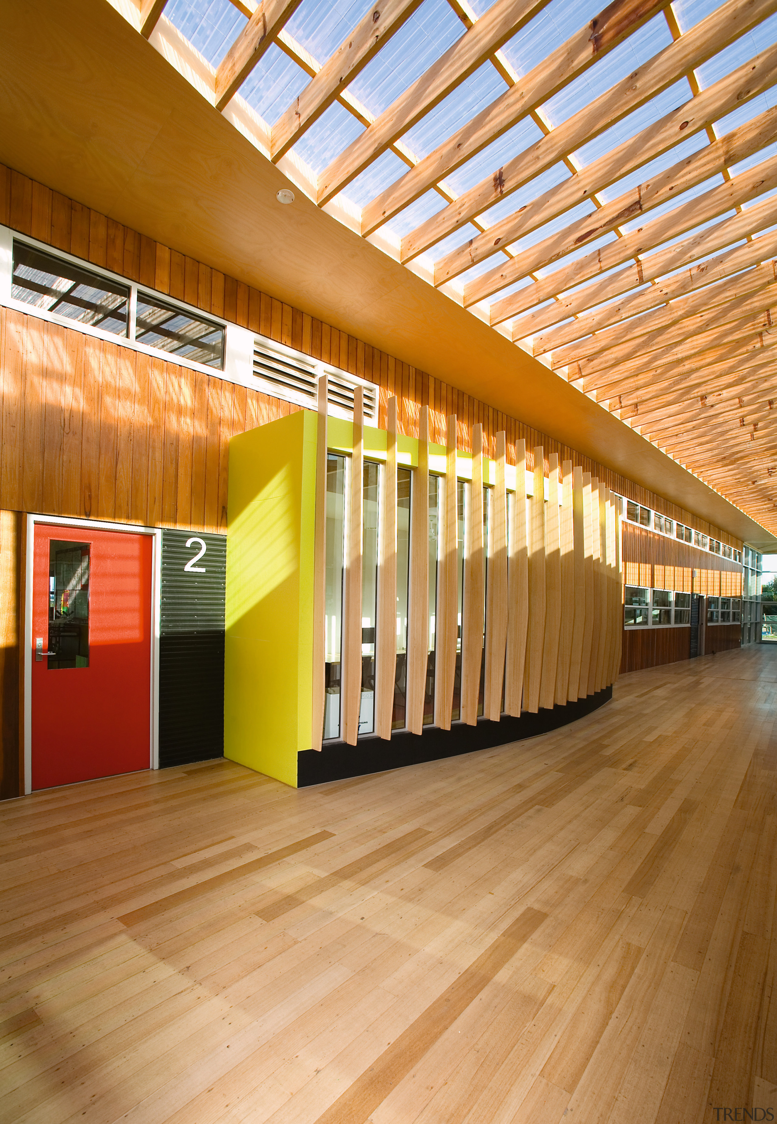 View of Williamstown High School in Melbourne. Designed architecture, ceiling, daylighting, floor, flooring, interior design, lobby, wood, orange, brown