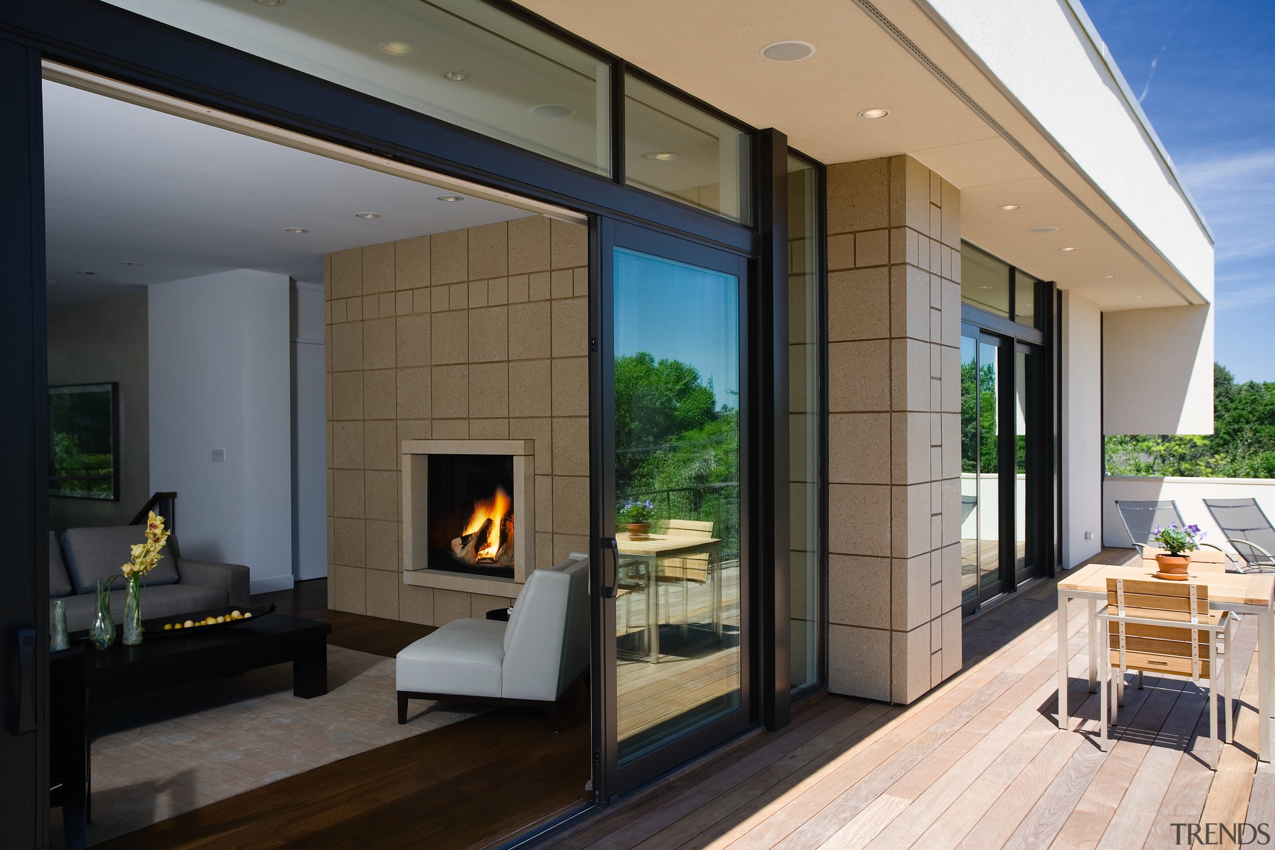 view of the floor to ceiling  sliding door, hearth, house, interior design, living room, real estate, window, black