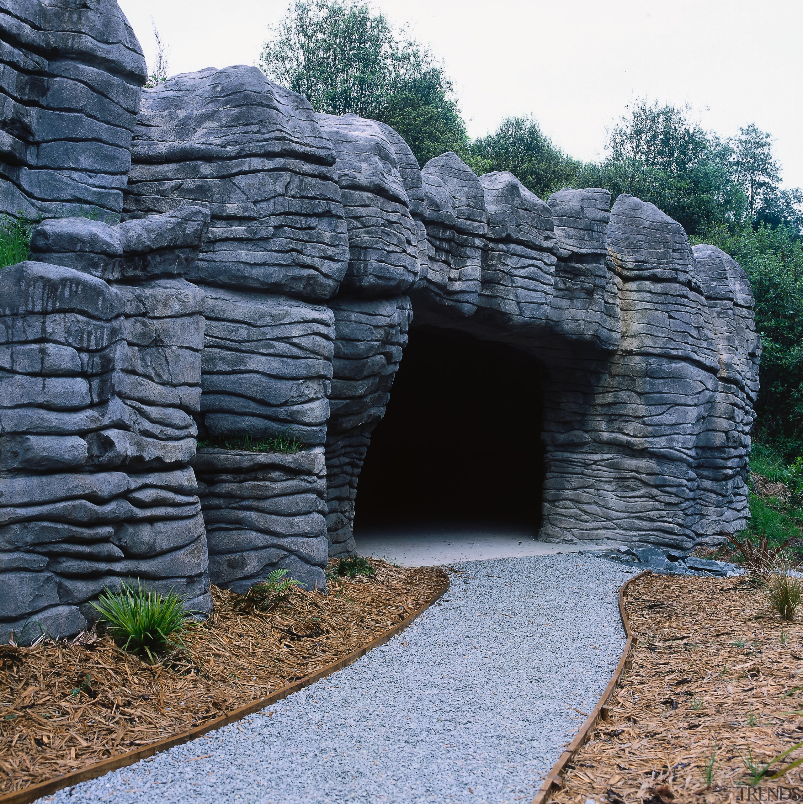 A view of the construction work performed by grass, rock, ruins, wall, black