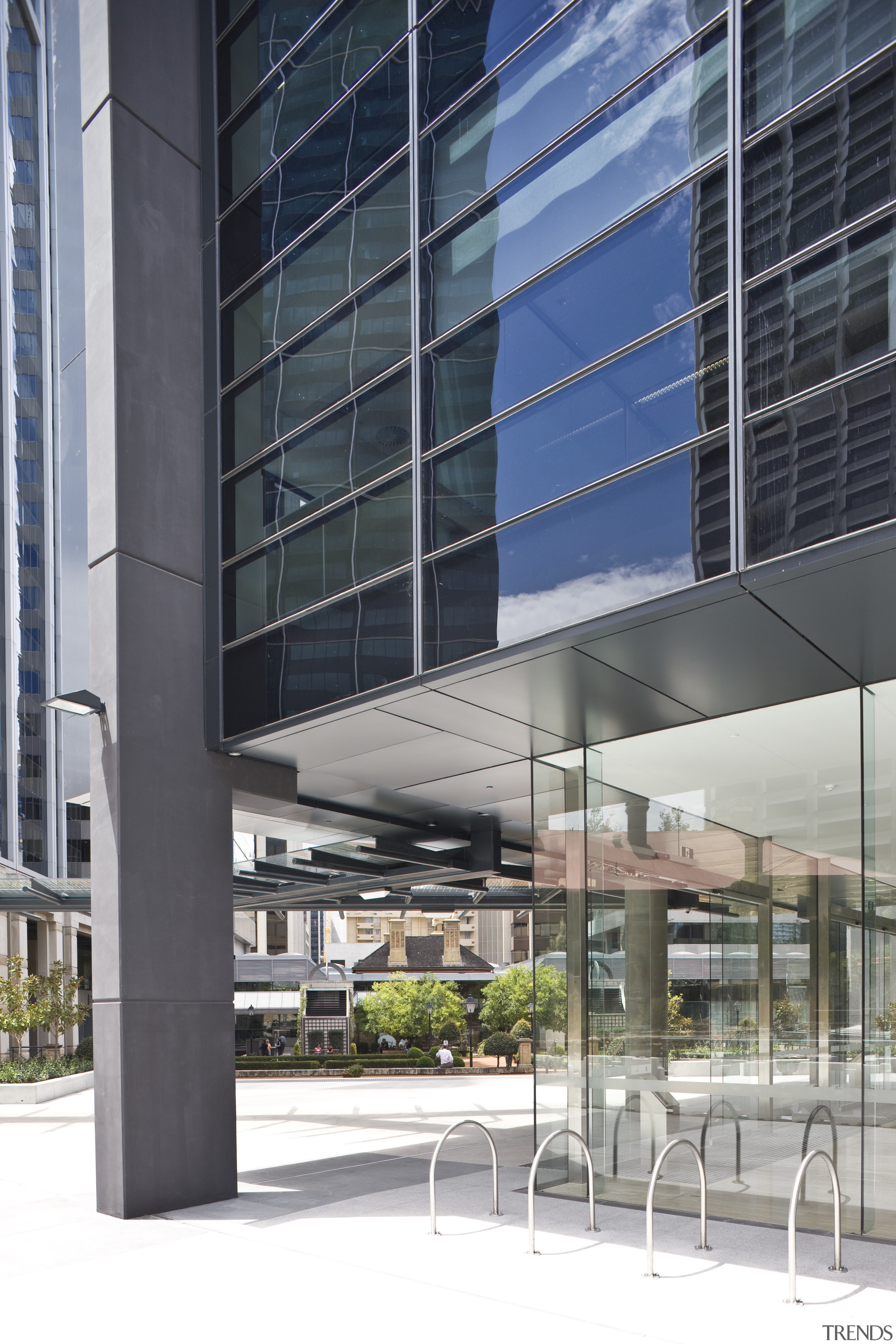 Exterior view of the eco-friendly commercial office tower architecture, building, commercial building, condominium, corporate headquarters, facade, glass, headquarters, metropolitan area, mixed use, gray, black