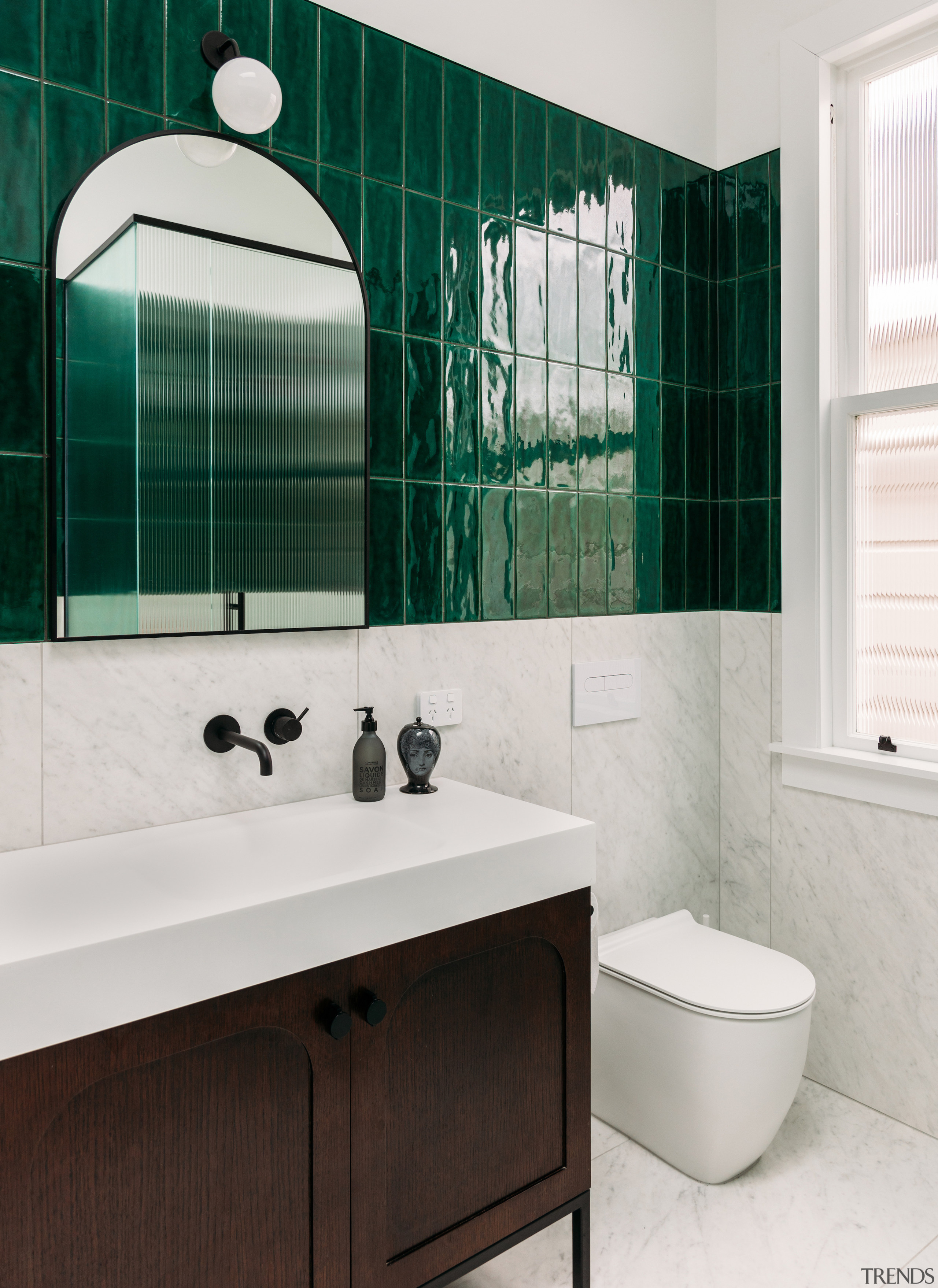 Main bathroom with standing furniture-look vanity. 