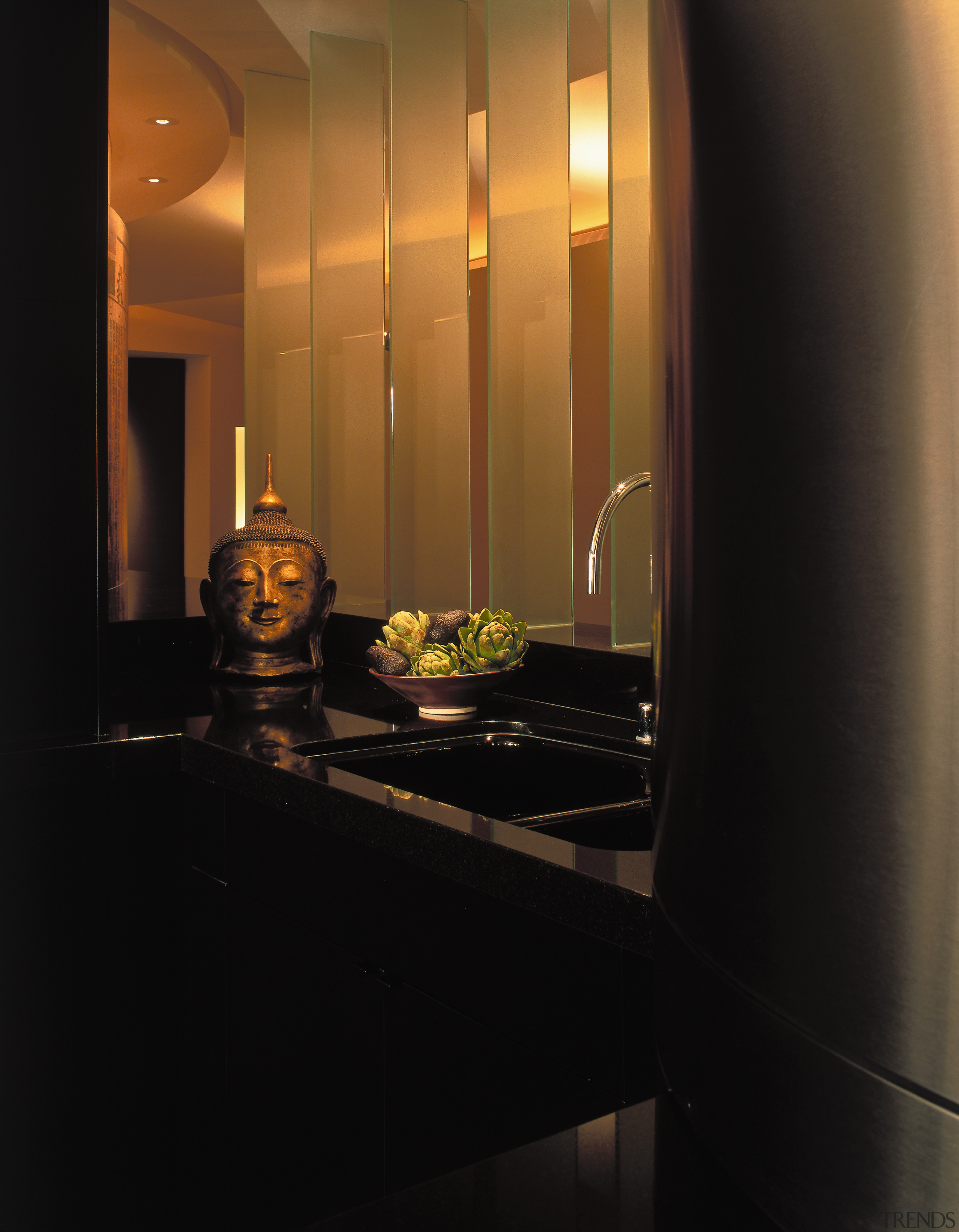 A close up view of the sink area, ceiling, countertop, interior design, light, light fixture, lighting, room, under cabinet lighting, black